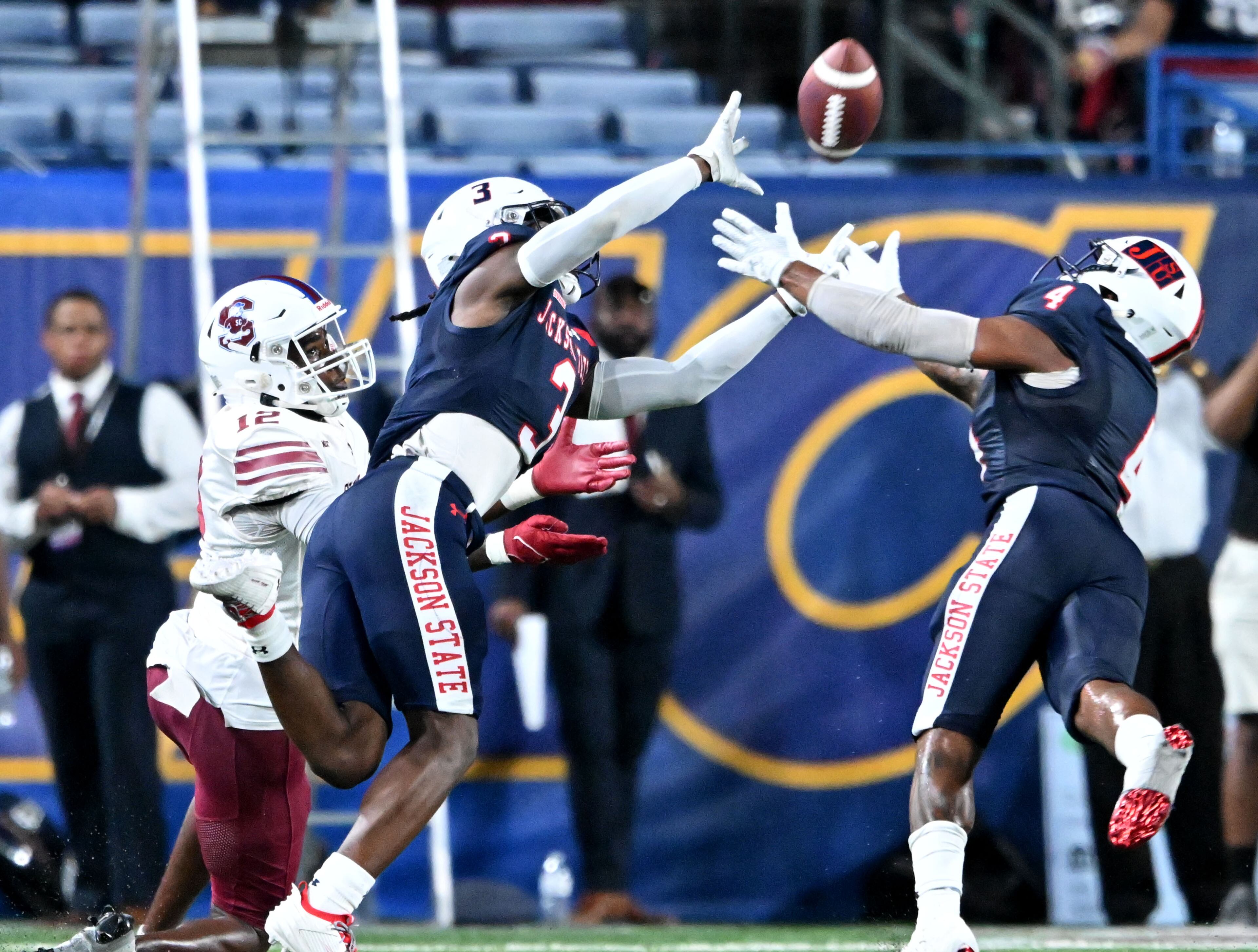 Jackson State's cornerback Jaheem Hazel (3) and safety Solomon Rogers (right) defend against South Carolina State's wide receiver Nigel Johnson (12) during the 2023 MEAC/SWAC Challenge at Center Parc Stadium, Saturday, August 26, 2023, in Atlanta. Jackson State won 37-7 over South Carolina State. (Hyosub Shin / Hyosub.Shin@ajc.com)