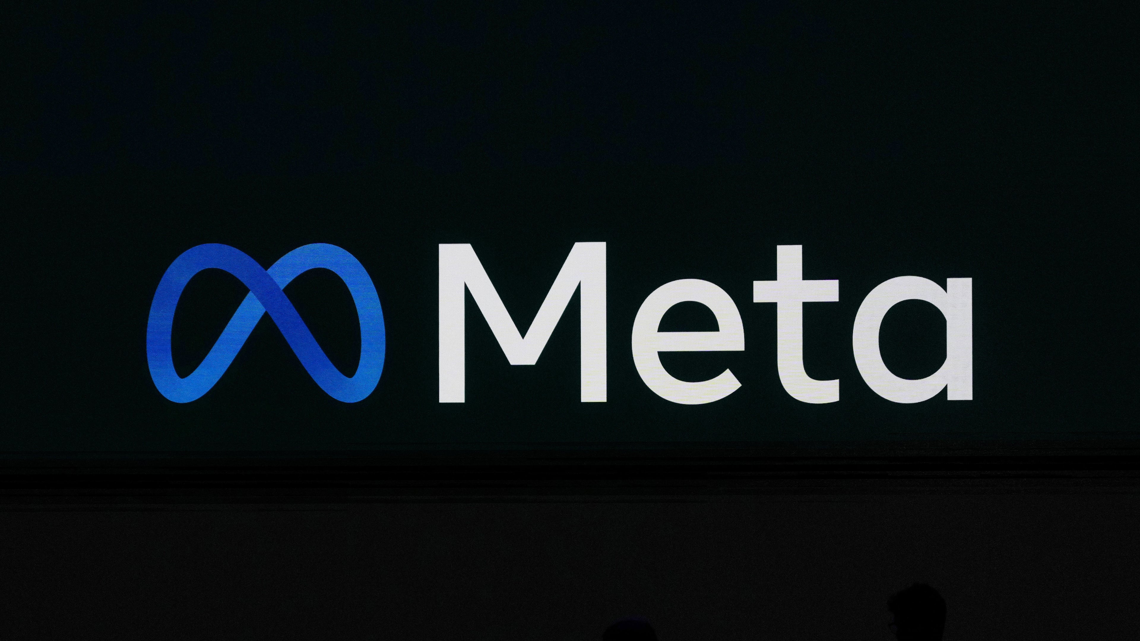 FILE - A Meta logo is shown on a video screen at LlamaCon 2025, an AI developer conference, in Menlo Park, Calif., April 29, 2025. (AP Photo/Jeff Chiu, File)