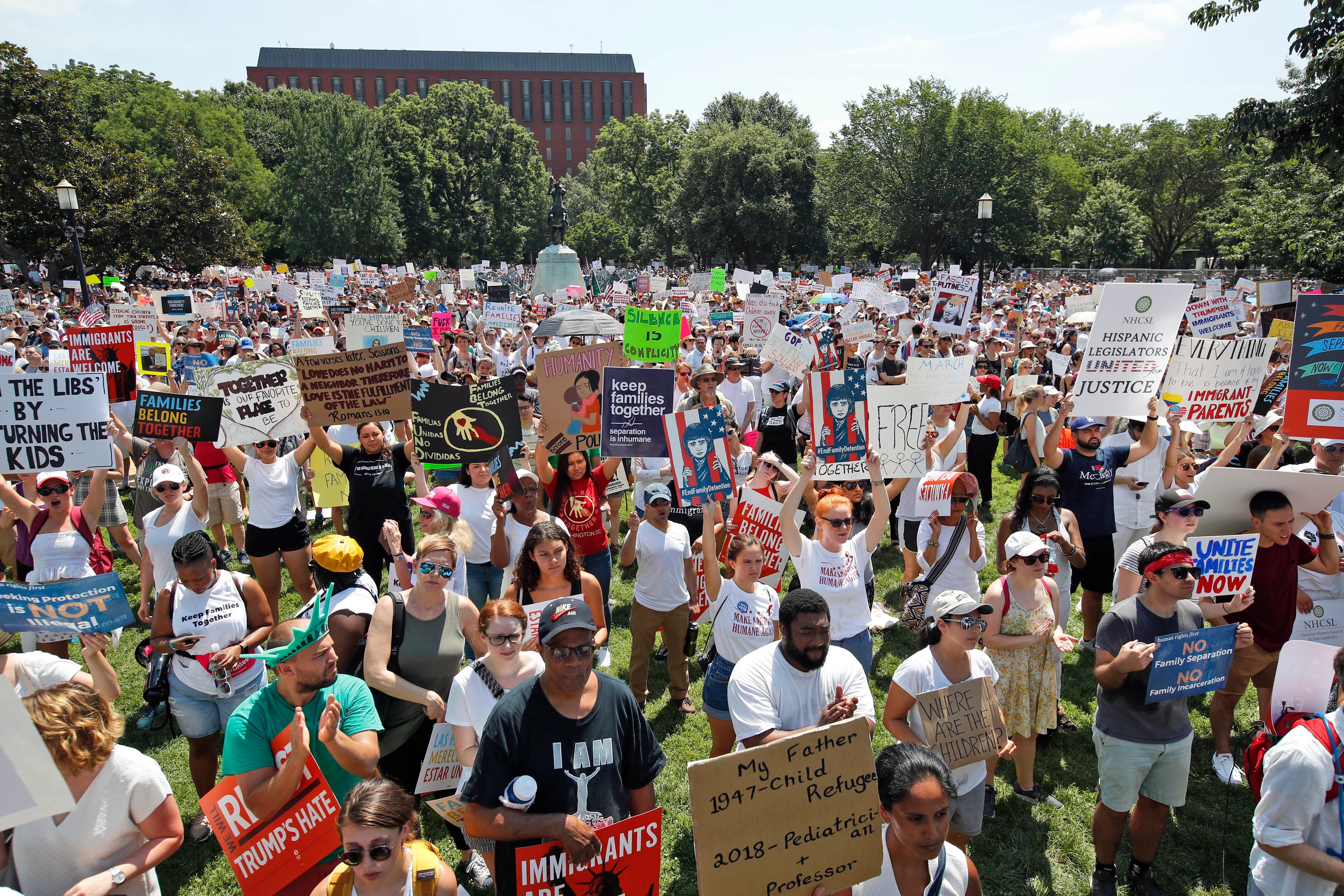 Activists protest the Trump administration's approach to illegal border crossings and separation of children from immigrant parents in Lafayette Square across from the White House, Saturday, June 30, 2018, in Washington. (AP Photo/Alex Brandon)