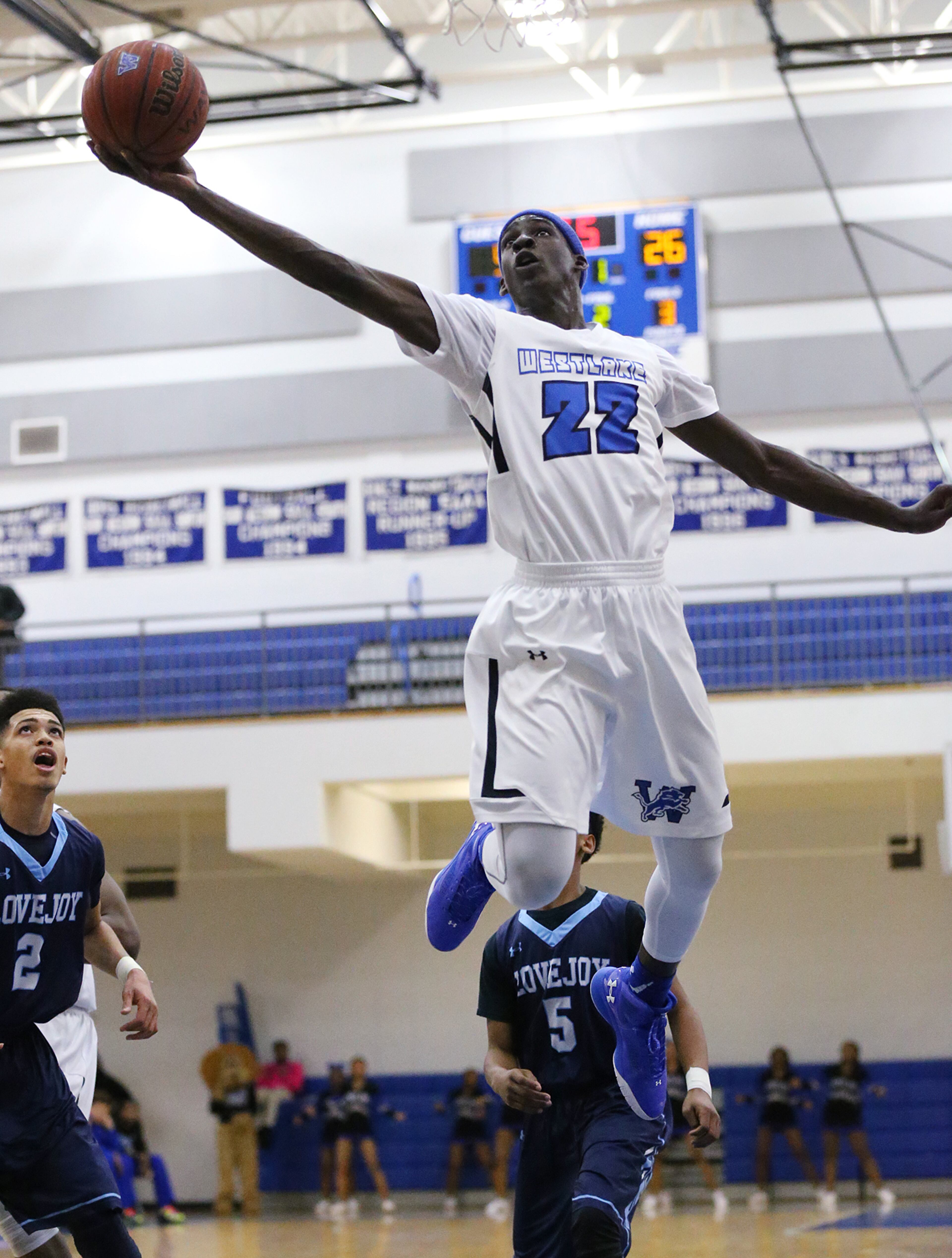 Westlake Lions Raquan Wilkins soars to the basket for two points past Lovejoy defenders in a first round playoff basketball game on Wednesday, Feb 17, 2016, in Atlanta. Curtis Compton / ccompton@ajc.com