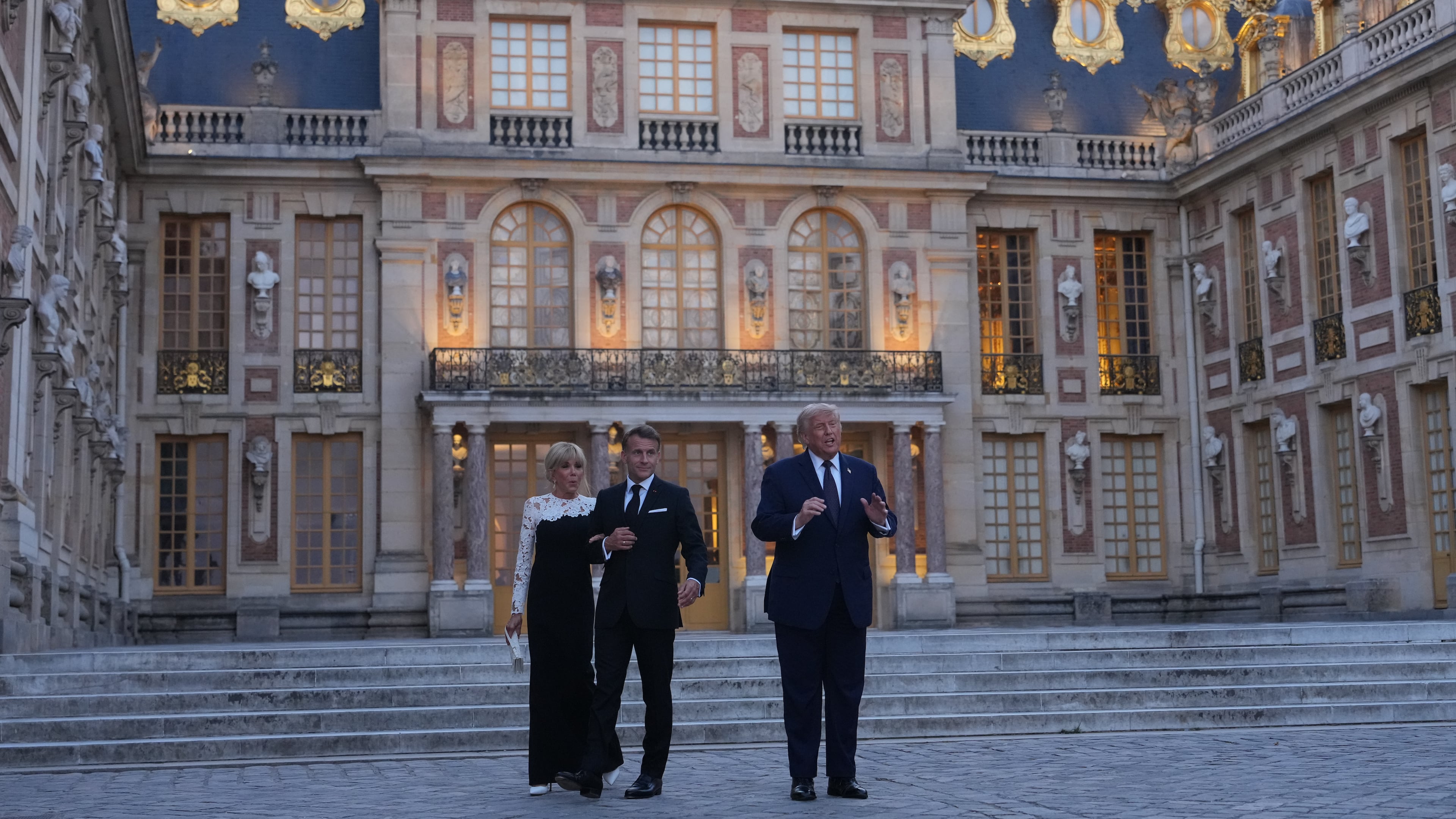 U.S. President Donald Trump is greeted by French President Emmanuel Macron and first lady Brigitte Macron as he arrives at the Palace of Versailles, Wednesday, June 17, 2026, in Versailles, France. (AP Photo/Julia Demaree Nikhinson)