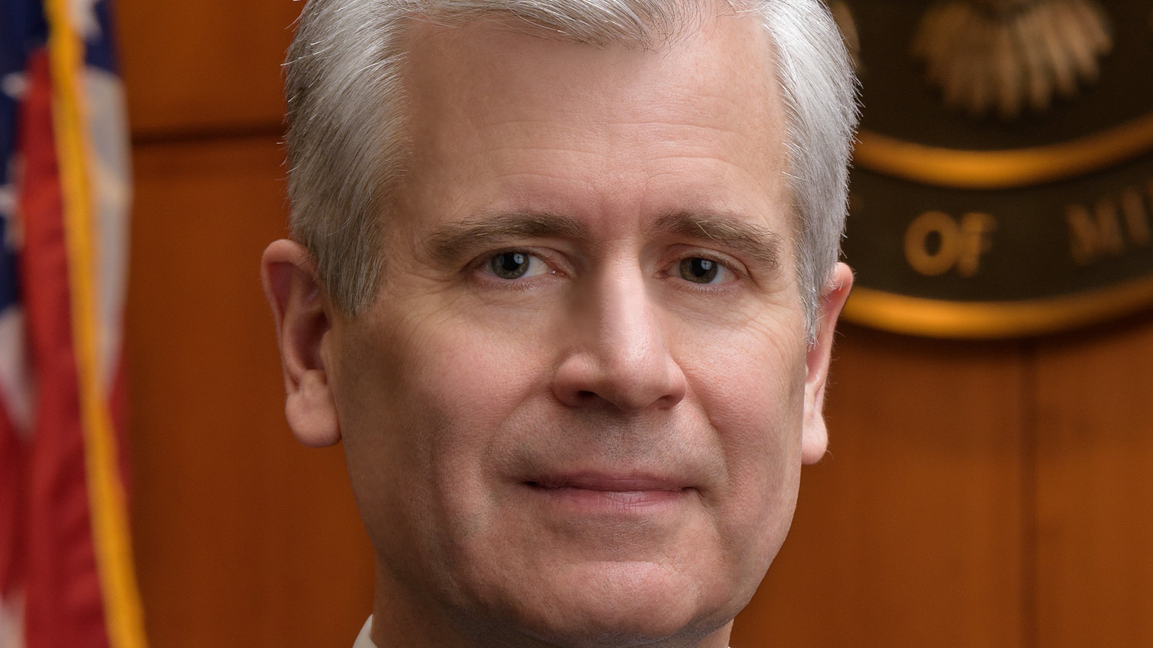 This undated photo provided by the U.S. District Court of Minnesota Thursday, Jan. 29, 2026, shows Chief U.S. District Judge Patrick Schiltz posing for a portrait in his Minneapolis courtroom. (U.S. District Court of Minnesota via AP)