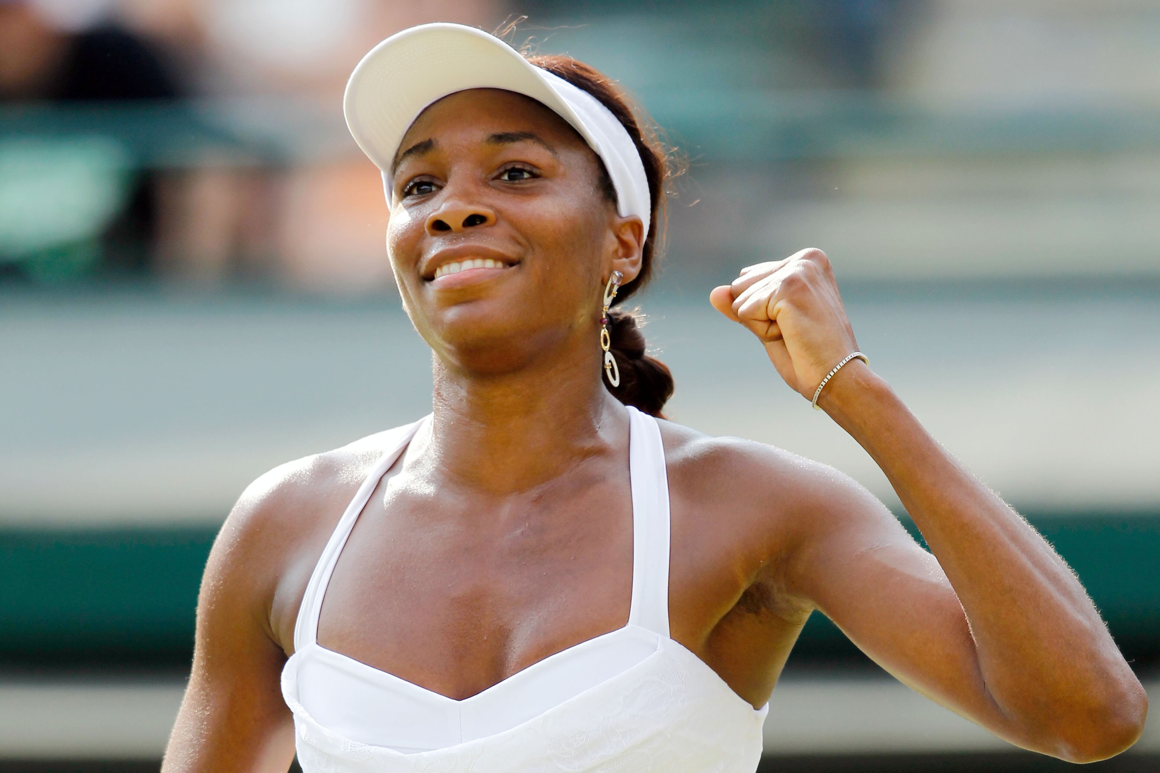 Venus Williams of USA celebrates match point during her match against Alisa Kleybanova of Russia on Day Five of the Wimbledon Lawn Tennis Championships at the All England Lawn Tennis and Croquet Club on June 25, 2010 in London, England. (Photo by Matthew Stockman/Getty Images)