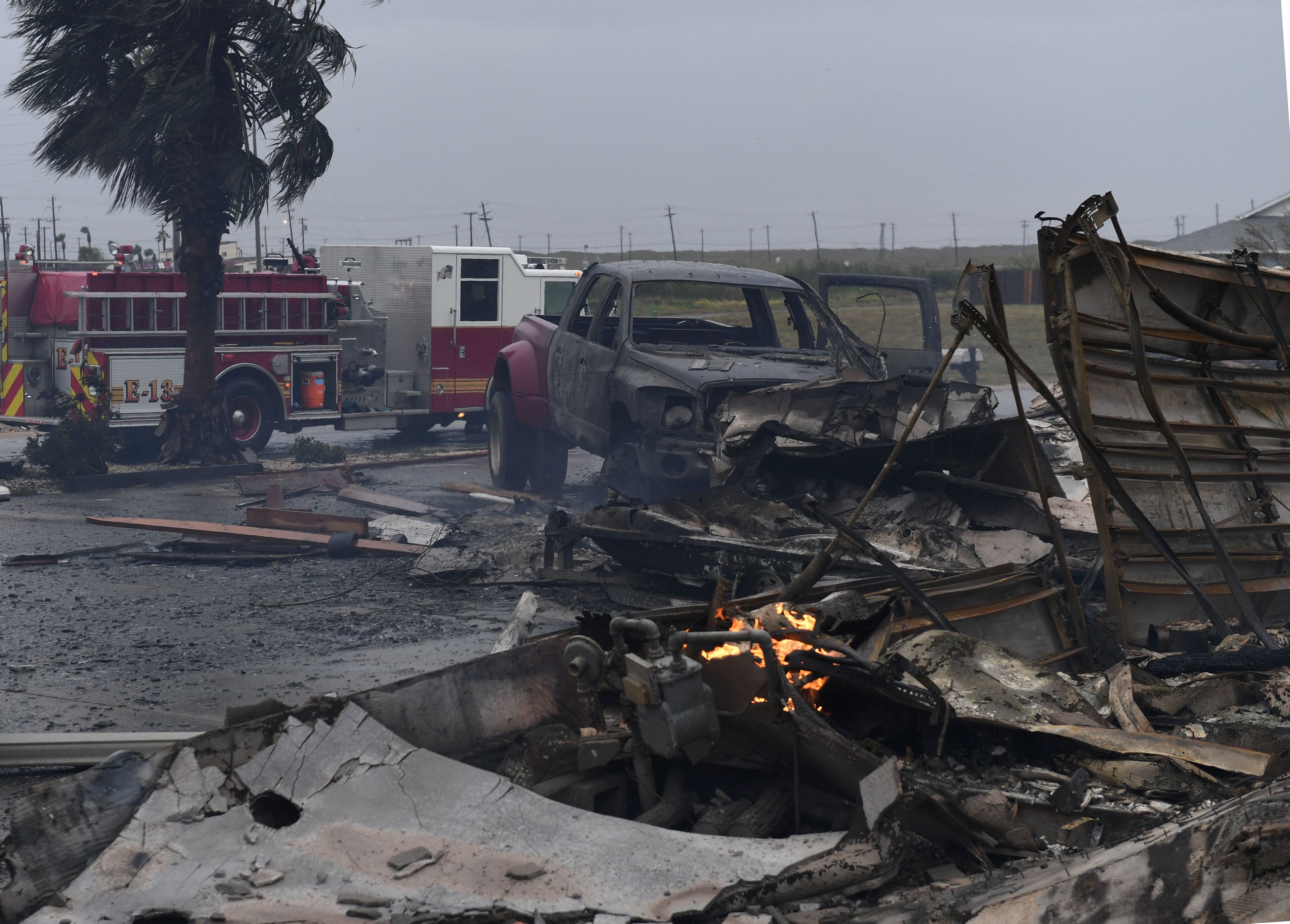 A burnt out house that caught fire after Hurricane Harvey hit Corpus Christi, Texas is seen on August 26, 2017. Hurricane Harvey hit the Texas coast with forecasters saying its possible for up to 3 feet of rain and 125 mph winds. / AFP PHOTO / MARK RALSTON (Photo credit should read MARK RALSTON/AFP/Getty Images)