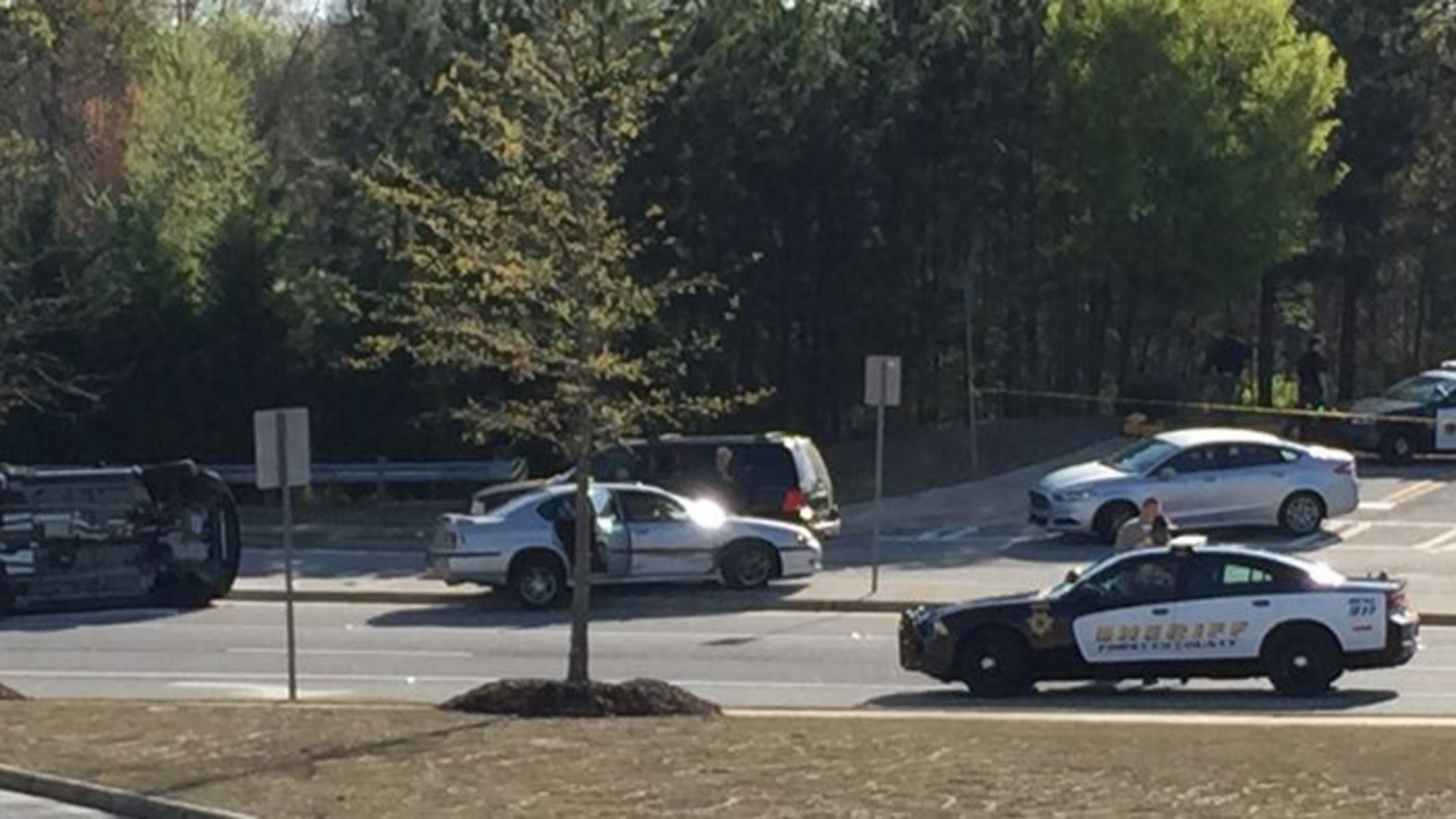 Officials say three law enforcement officers were injured as a result of the suspect crashing his vehicle into two of their vehicles, tipping one on its side. (Channel 2 Action News)