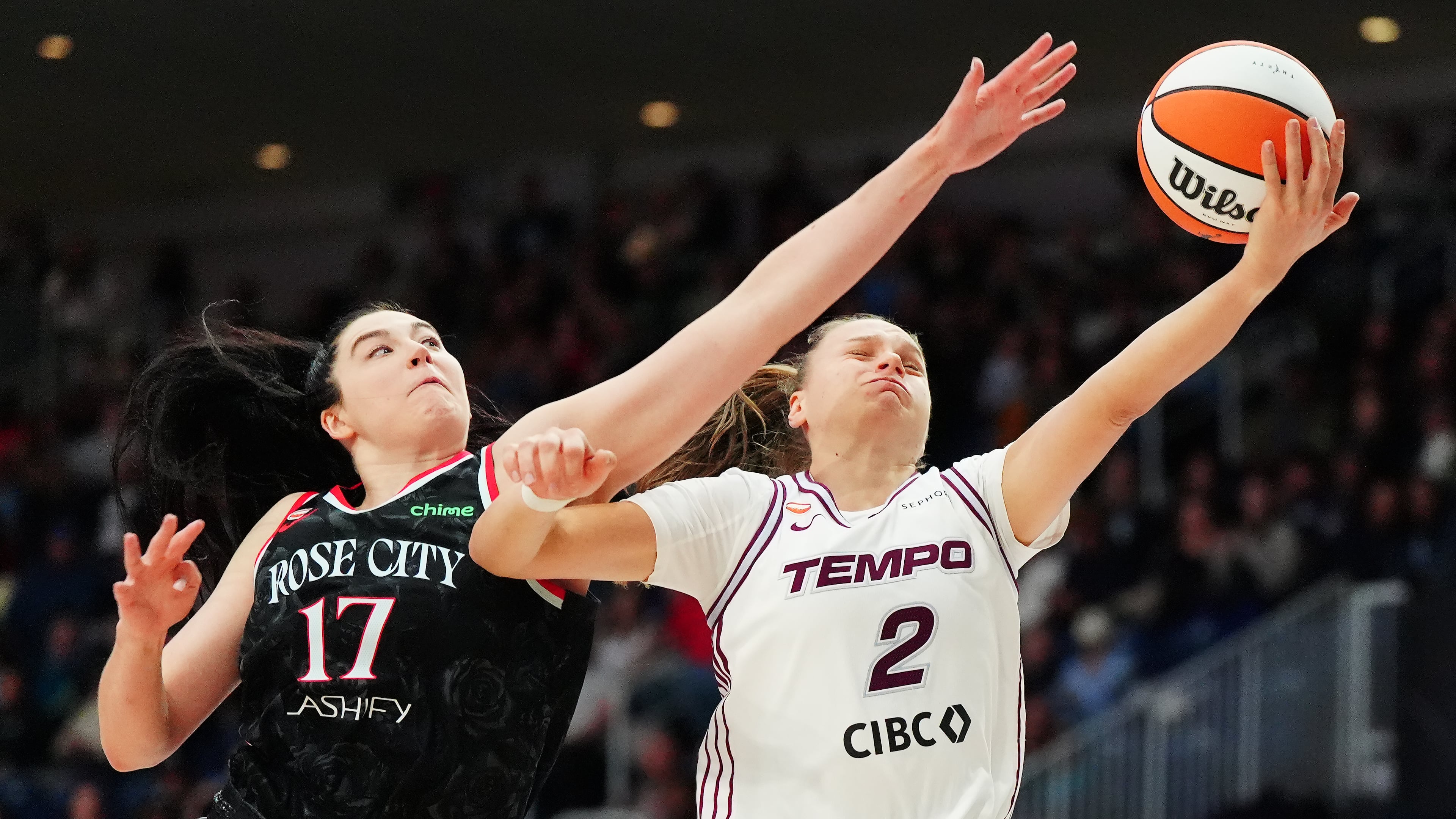 Portland Fire's Megan Gustafson (17) fouls Toronto Tempo's Laura Juskaite (2) during second-half WNBA basketball game action in Toronto, Saturday May 23, 2026. (Frank Gunn/The Canadian Press via AP)