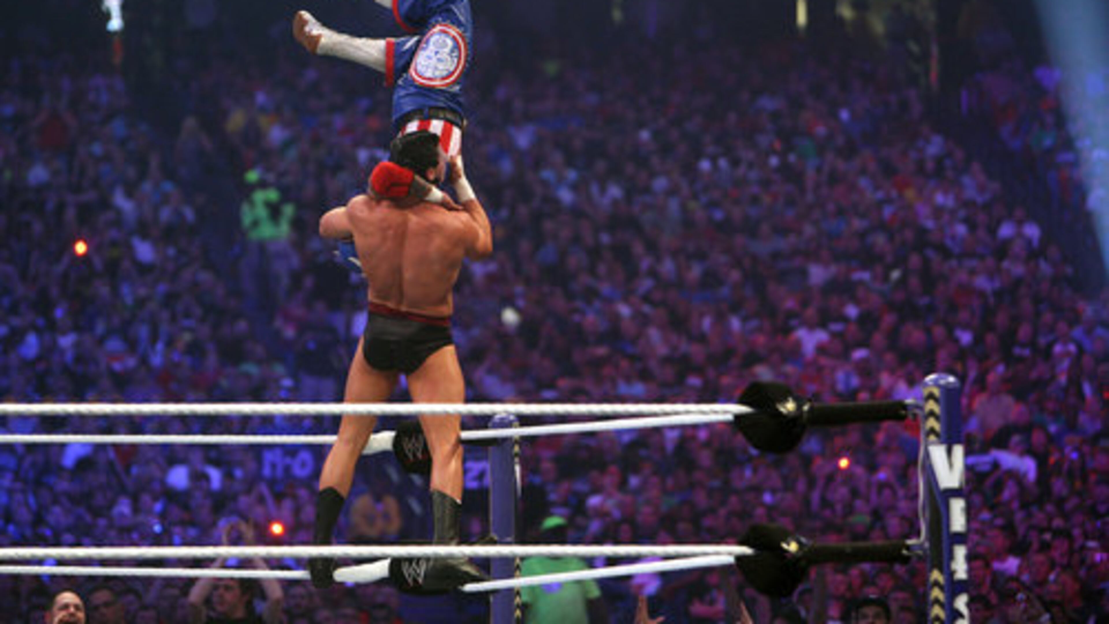 Cody Rhodes plays to the chanting of the crowd before executing a back body slam to Rey Mysterio at the 27th annual Wrestlemania, held at the Georgia Dome in 2011. (AJC file photo)