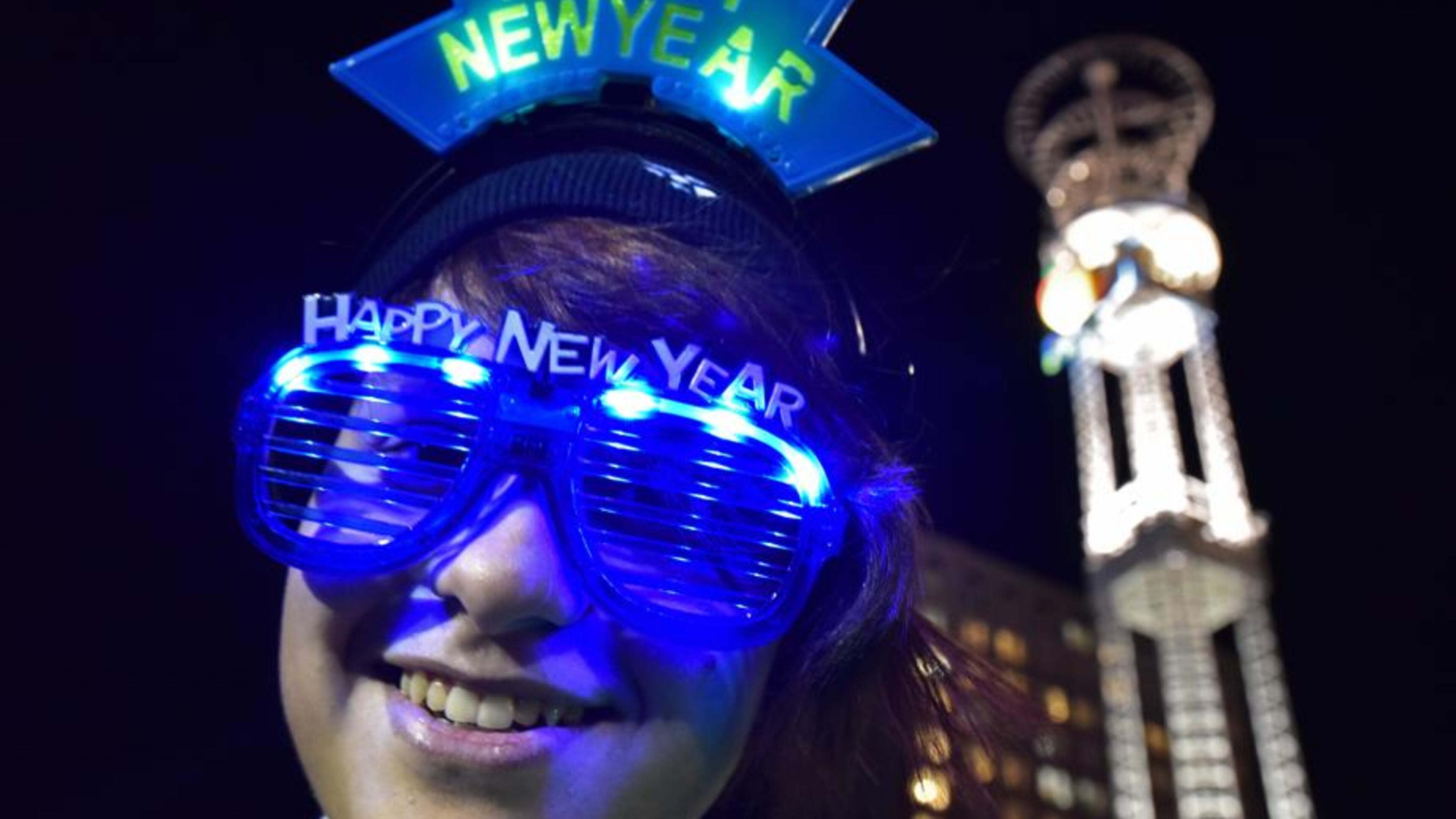 Daesum Butler, of Whitesburg, wears her New Year glasses at Underground Atlanta during Peach Drop 2016 on Thursday, December 31, 2015. HYOSUB SHIN / HSHIN@AJC.COM