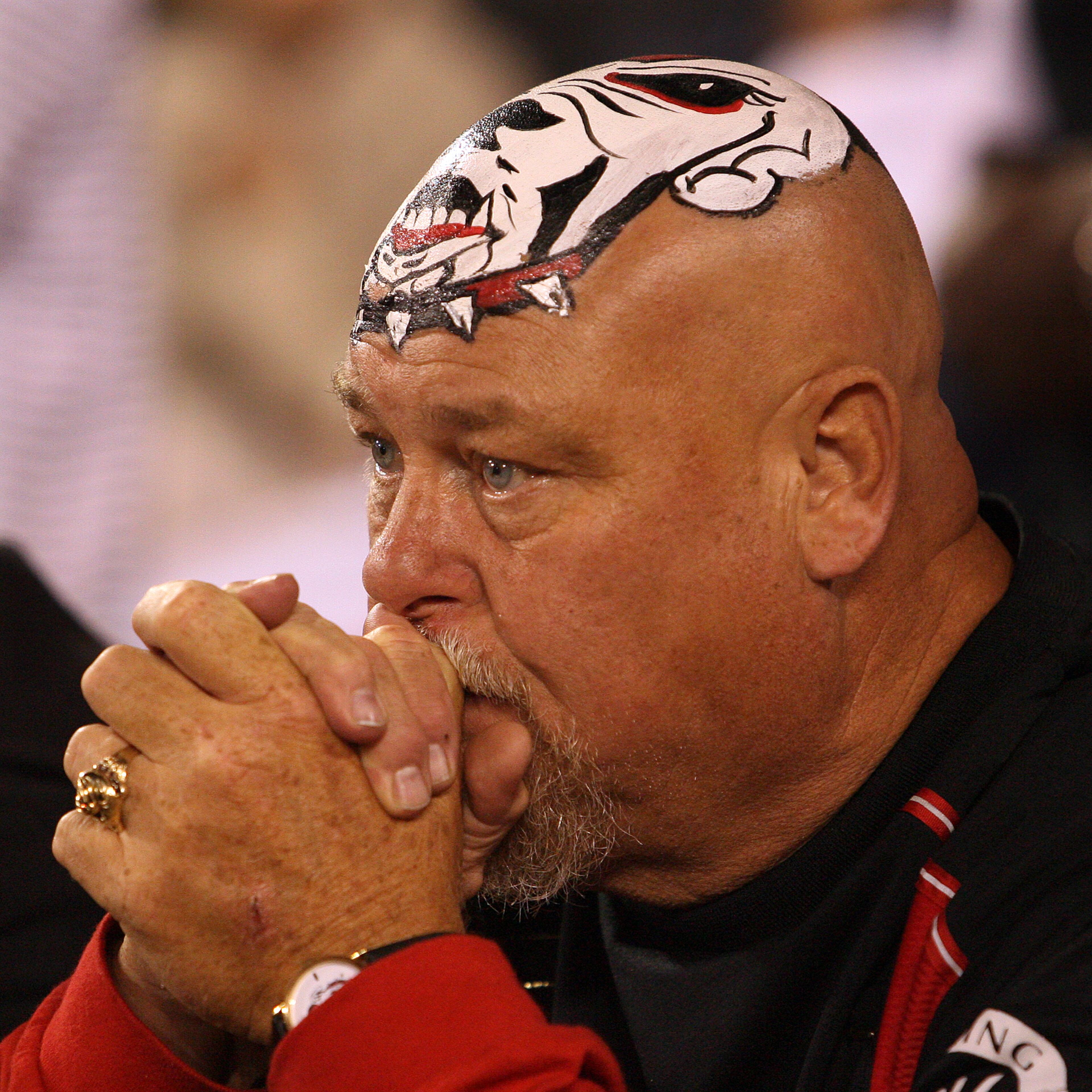 061007 ATHENS, GA. --TAKING IT HARD-- UGA fan Mike "Big Dawg" Woods, 55, from Colbert, Ga., reacts after Tennessee blocked Georgias punt in the endzone and recovered it for a touchdown and a 38-27 lead in Athens, Ga., on Saturday, Oct. 7, 2006. Tennessee won the game 51-33. (CURTIS COMPTON/staff)