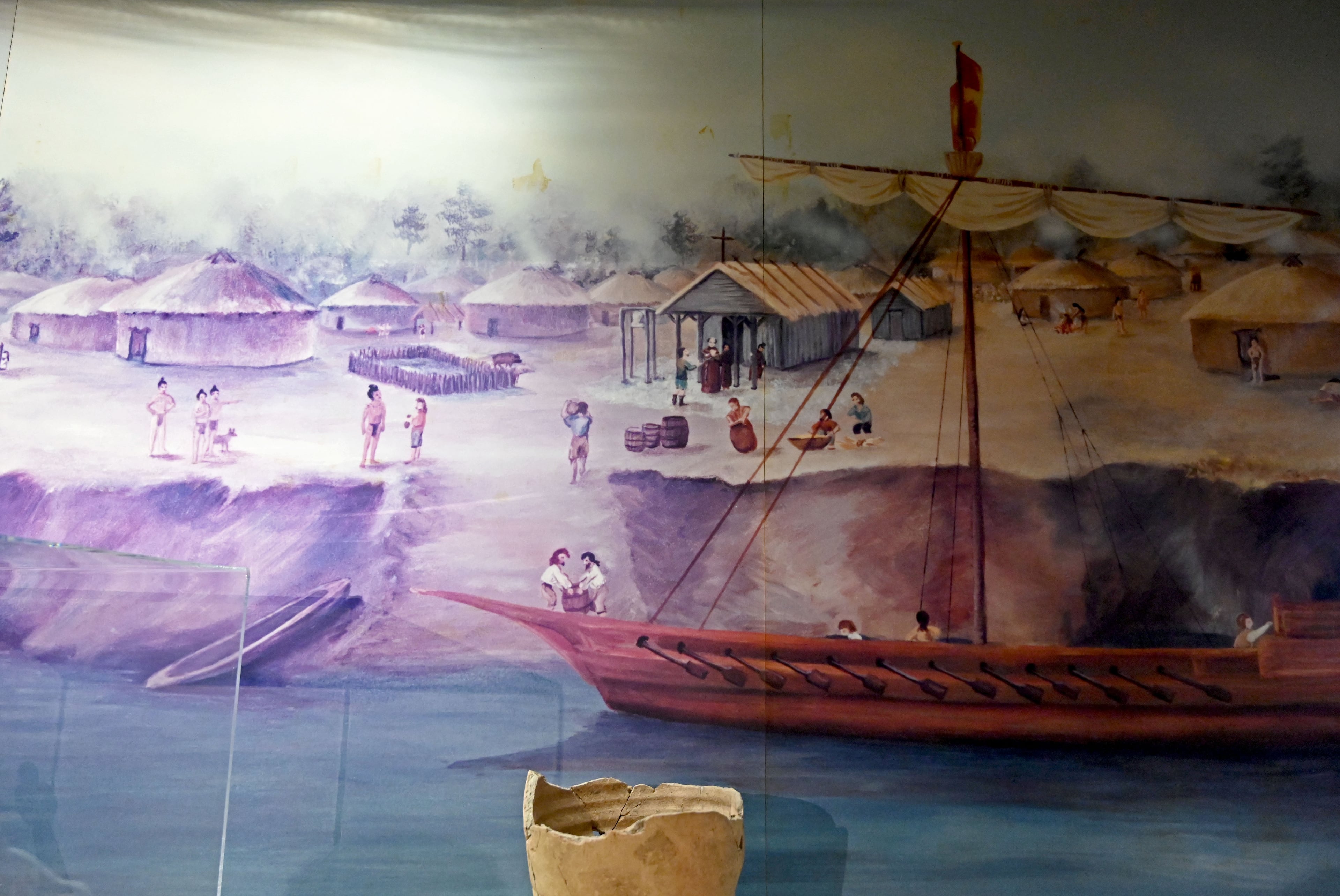 A painting depicting a Roman Catholic church in a Guale village is displayed in a museum at Fort King George State Historic Site in Darien. (Hyosub Shin/AJC)