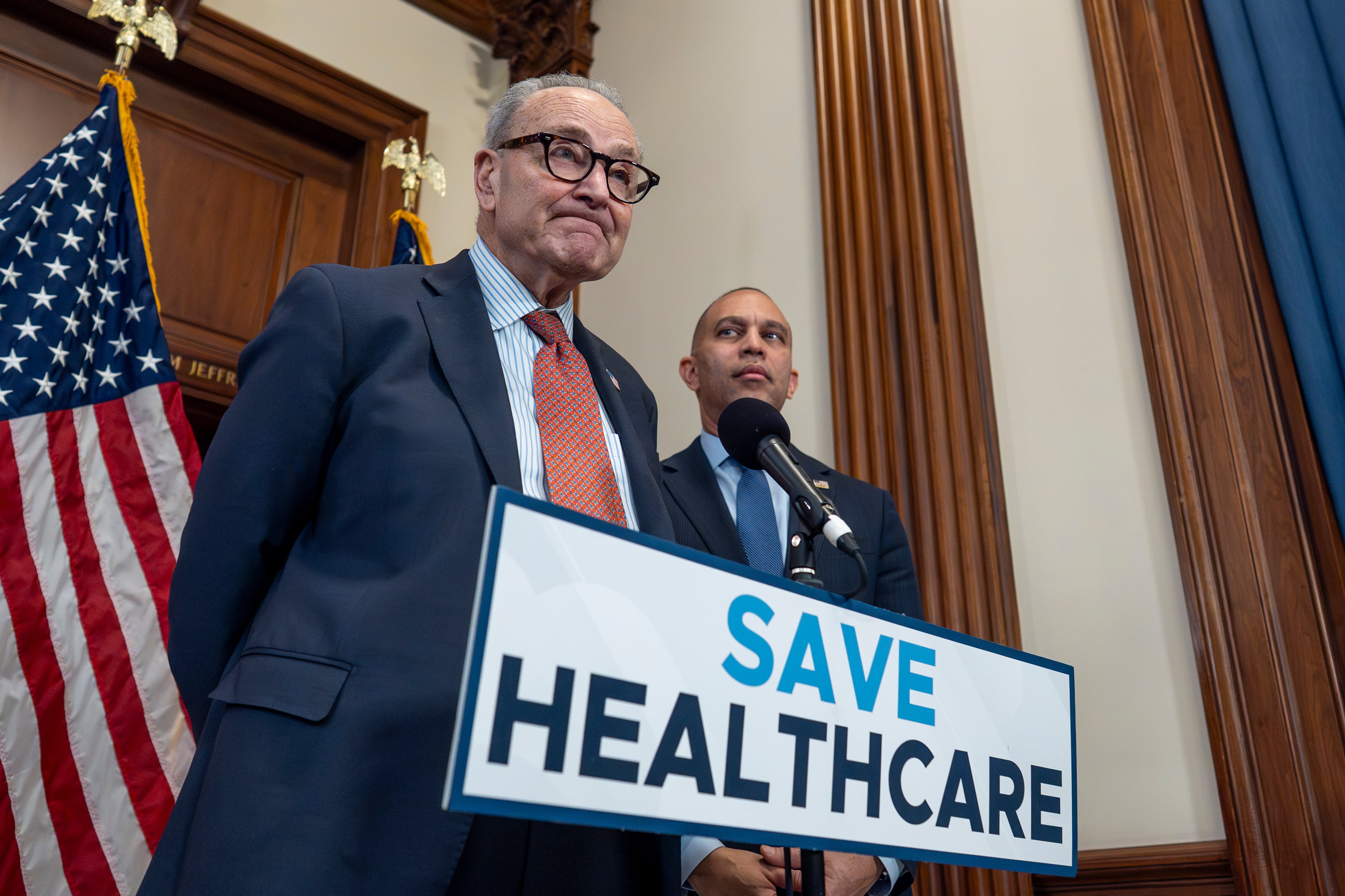 Senate Minority Leader Chuck Schumer (left) and House Minority Leader Hakeem Jeffries spoke to reporters earlier this month about why Democrats are pushing to keep health care subsidies. (J. Scott Applewhite/AP)