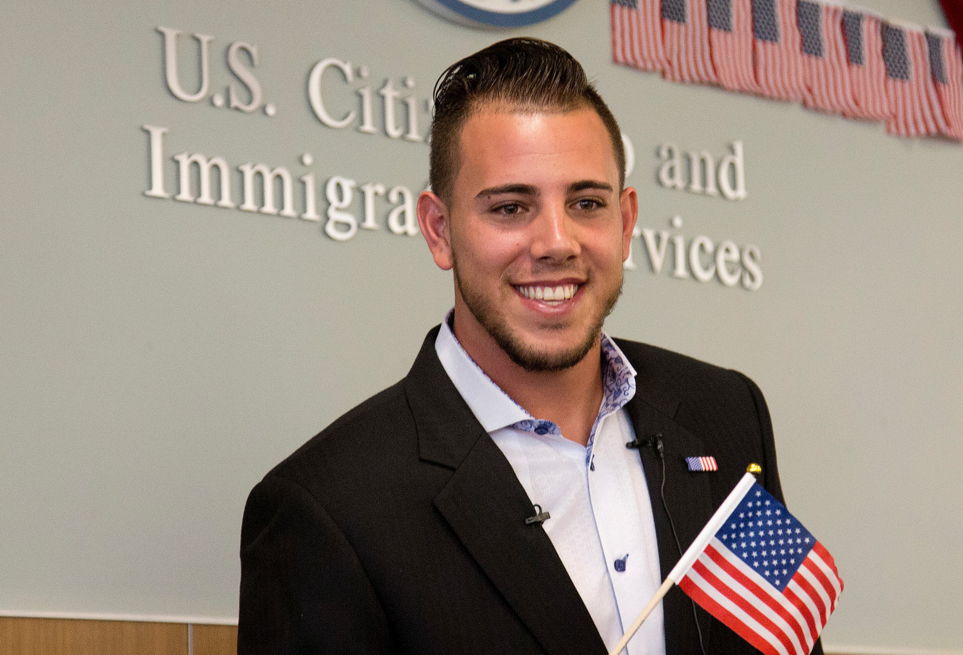 In this Friday, April 24, 2015, file photo, Miami Marlins pitcher Jose Fernandez smiles after becoming a U.S. citizen during a naturalization ceremony in Miami. The Marlins announced Sunday, Sept. 25, 2016, that ace right-hander Fernandez has died. The U.S. Coast Guard says Fernandez was one of three people killed in a boat crash off Miami Beach early Sunday. (AP Photo/J Pat Carter, File)