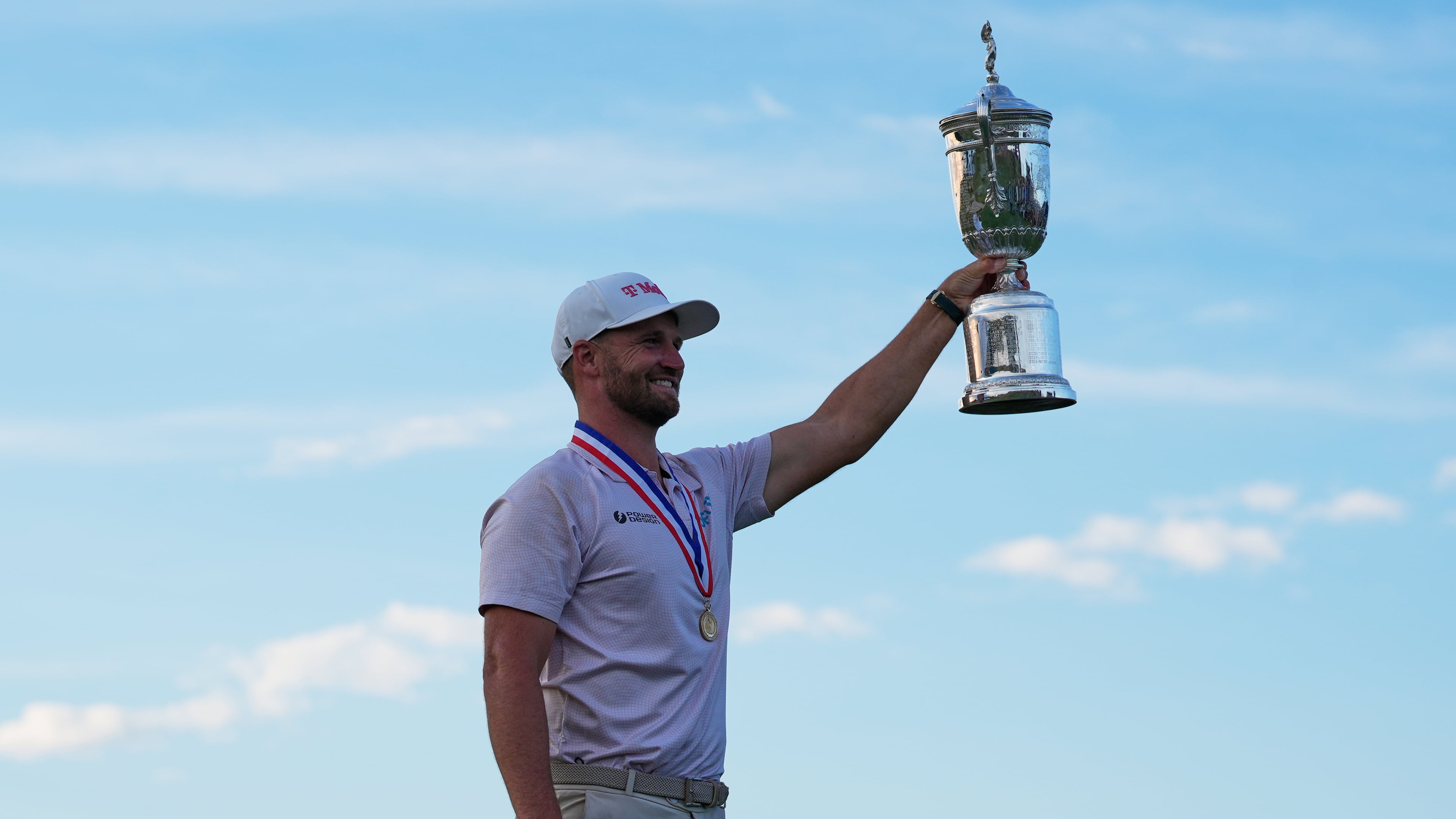 Wyndham Clark holds the trophy after winning the U.S. Open golf tournament at Shinnecock Hills Golf Club in Southampton, N.Y., Sunday, June 21, 2026. (AP Photo/Seth Wenig)