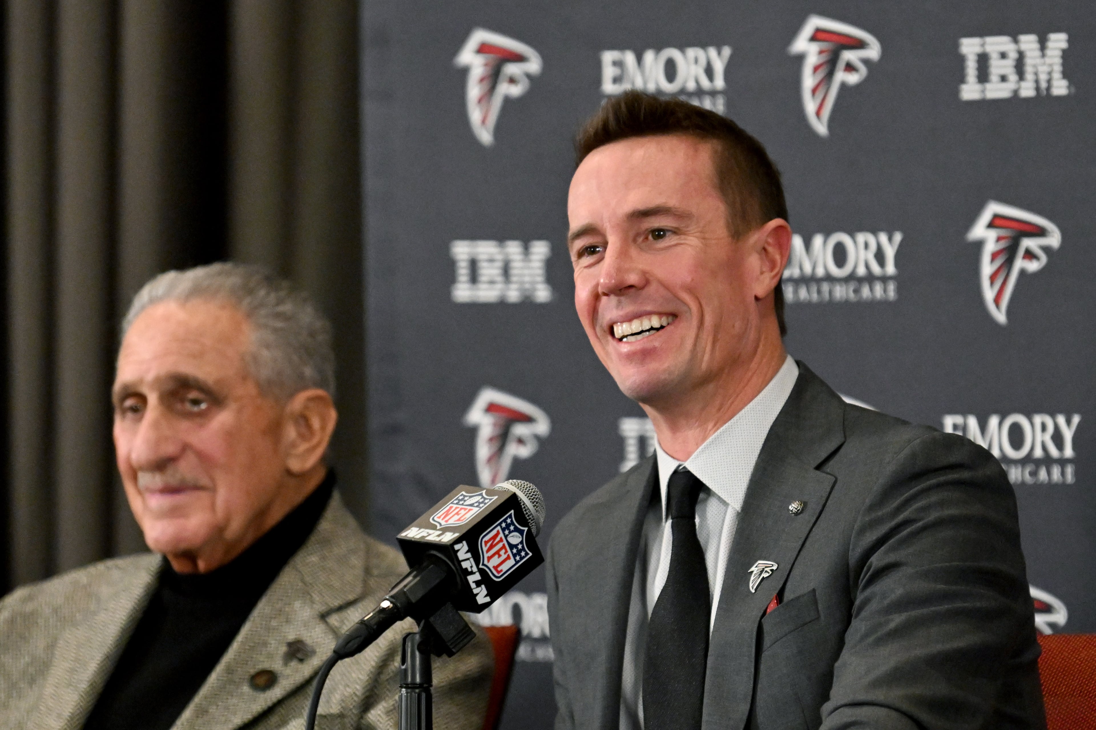 New Falcons president of football Matt Ryan speaks Arthur M. Blank sits next him during a news conference to introduce new Falcons president of football Matt Ryan, Tuesday, Jan. 13, 2026, in Flowery Branch. (Hyosub Shin/AJC)