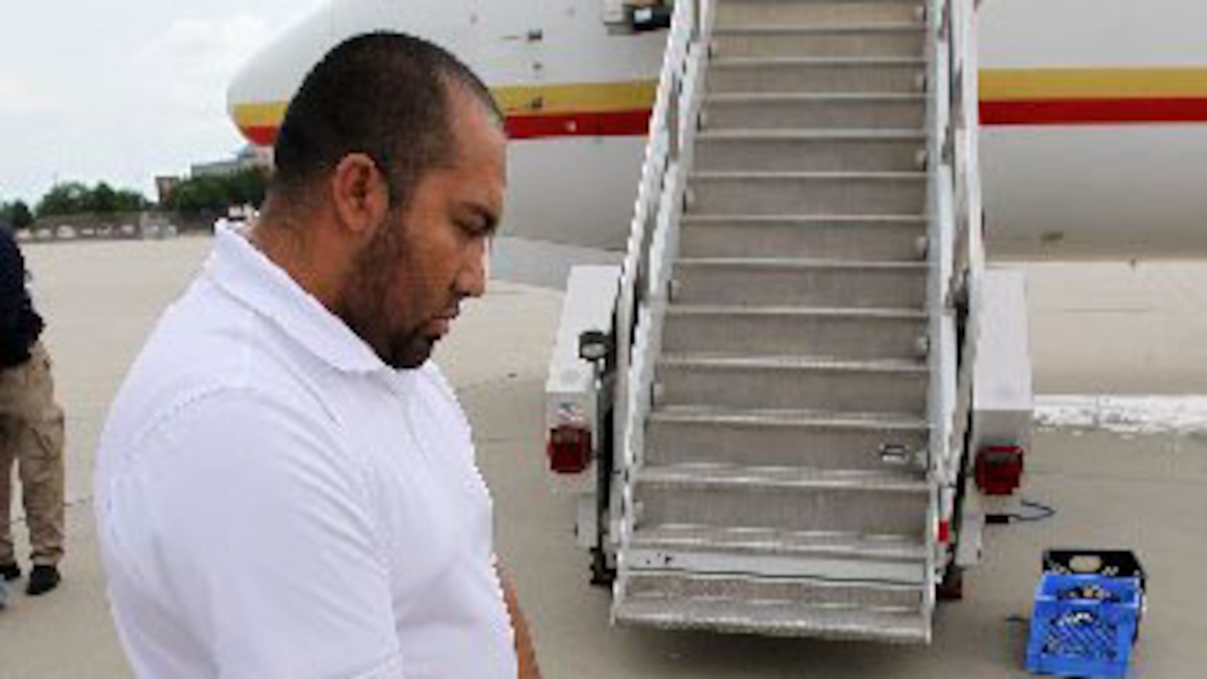 Martin Ballesteros, who was born in Mexico City, boards a U.S. Immigration and Customs Enforcement deportation flight out of Atlanta on Thursday, May 3, 2012. Curtis Compton/ccompton@ajc.com