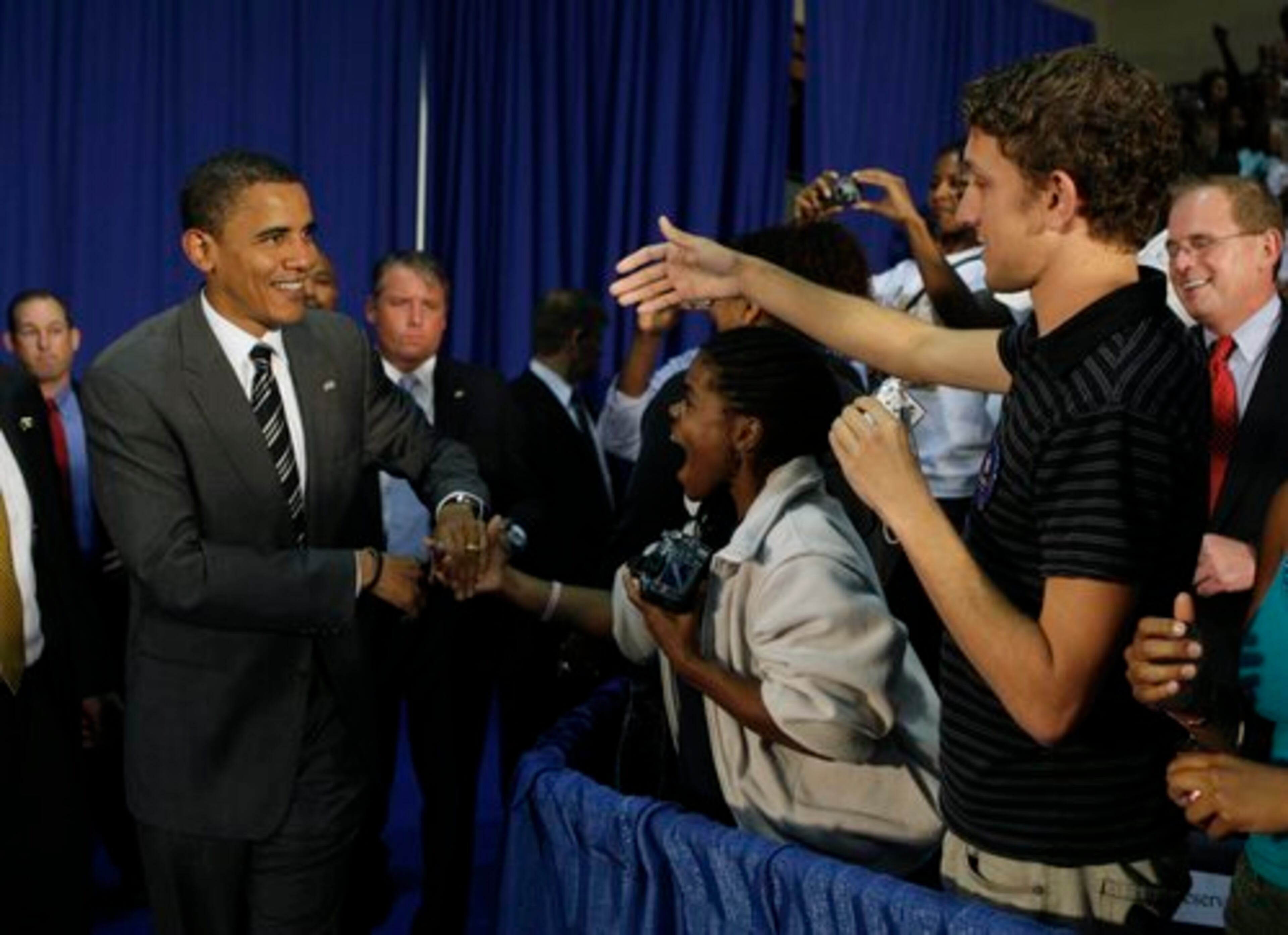 Sen. Barack Obama shakes hands with supporters at the town hall-style meeting in Powder Springs.