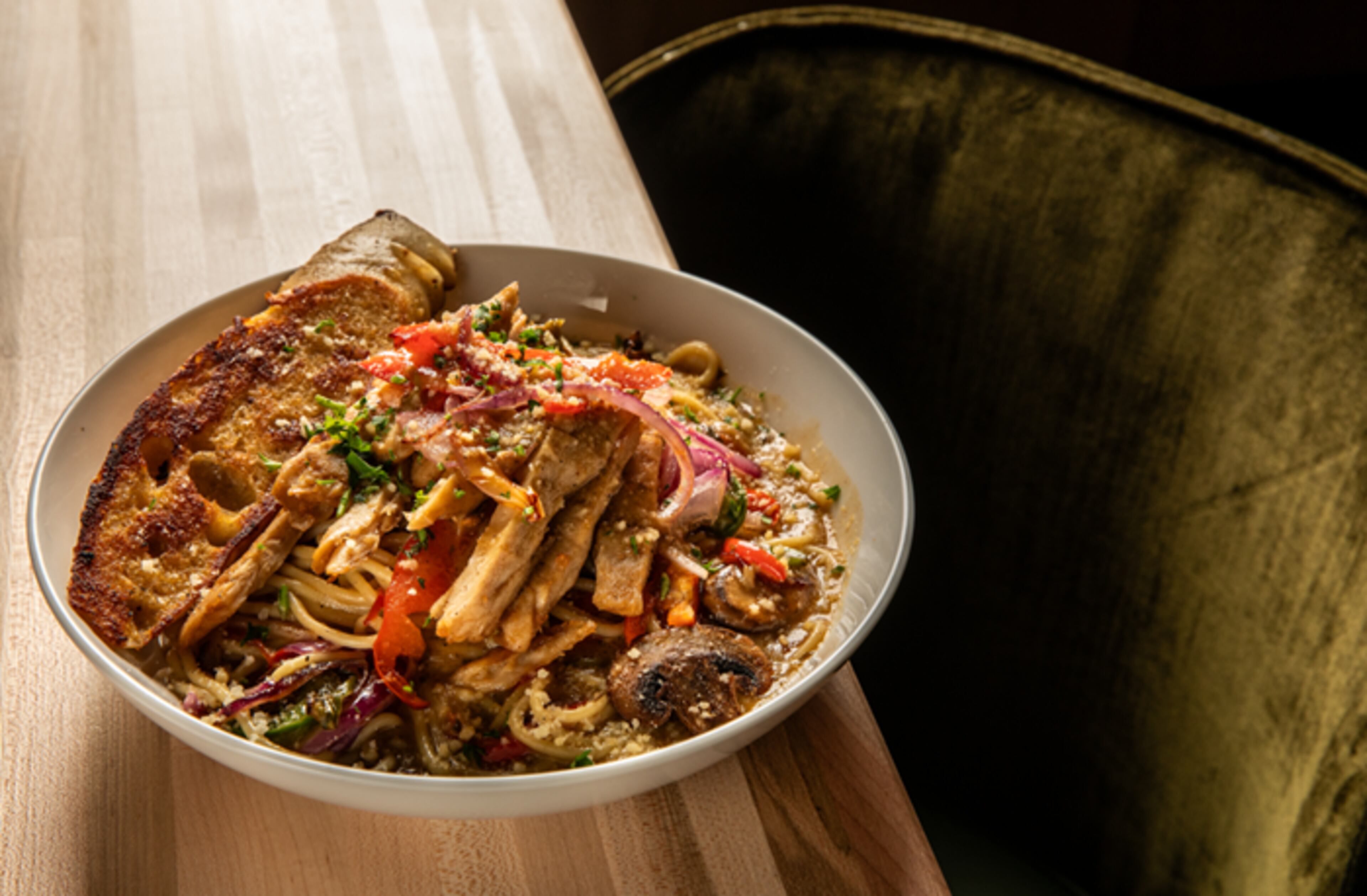 Pinky Cole Hayes has taken over the Boujee Southerner in Lawrenceville and reopened it as a second Bar Vegan location. The white spaghetti appears on the menu. / Courtesy of Bar Vegan