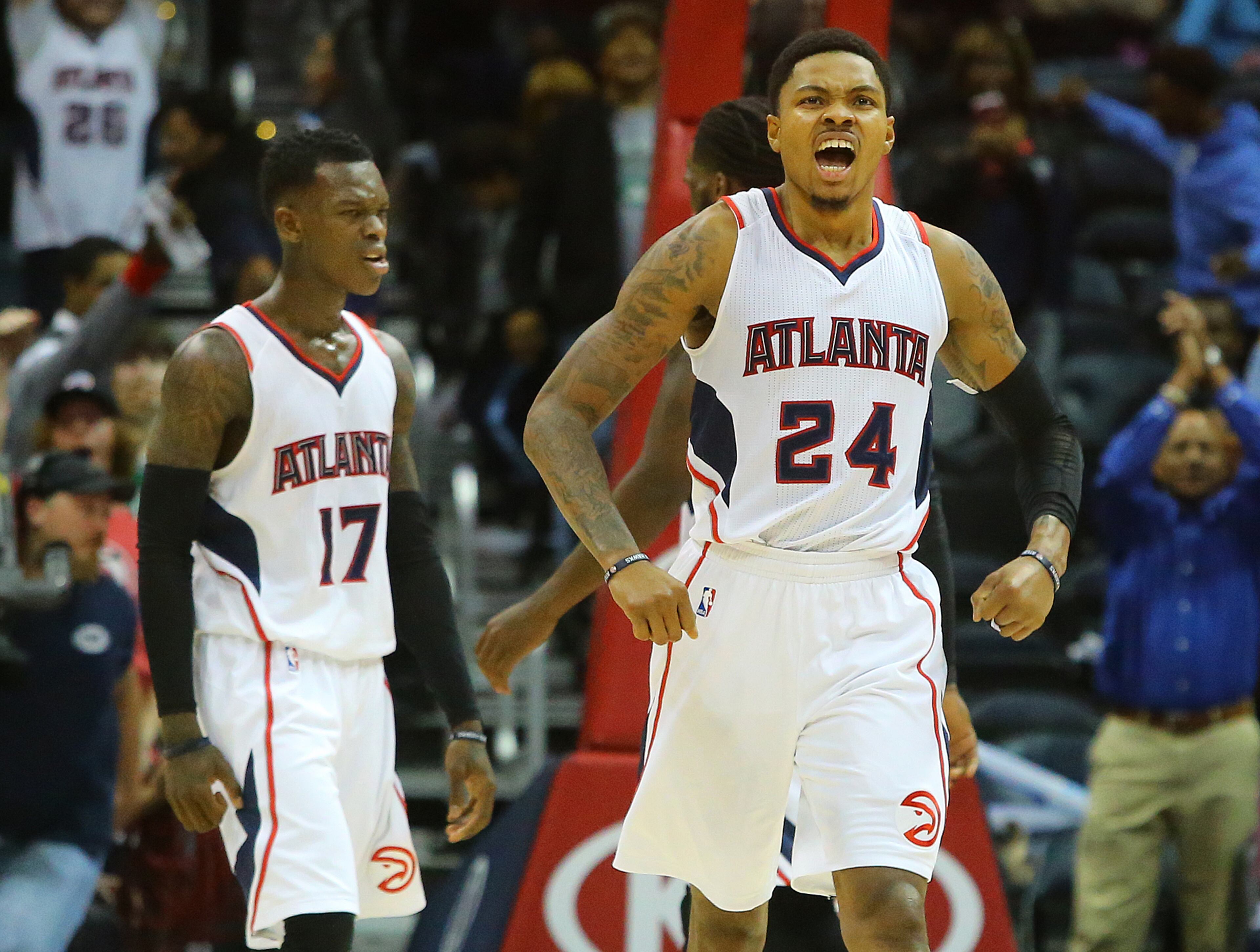 Hawks Kent Bazemore (right) and Dennis Schroder react to beating the Celtics 109-105 in an NBA basketball game on Tuesday, Dec. 2, 2014, in Atlanta. CURTIS COMPTON / CCOMPTON@AJC.COM