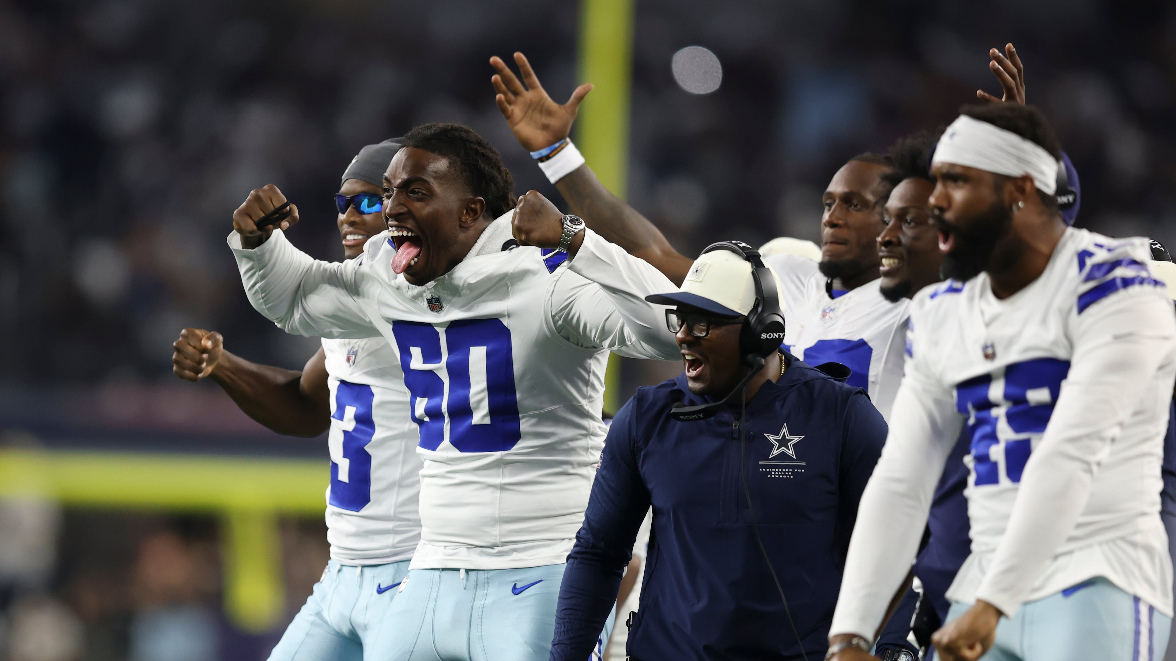 Dallas Cowboys offensive tackle Tyler Guyton (60) celebrates on the sideline after a two-point conversion against the New Orleans Saints during the second half of a preseason NFL football game, in Arlington, Texas, Friday, Aug. 28, 2026. (AP Photo/Gareth Patterson)