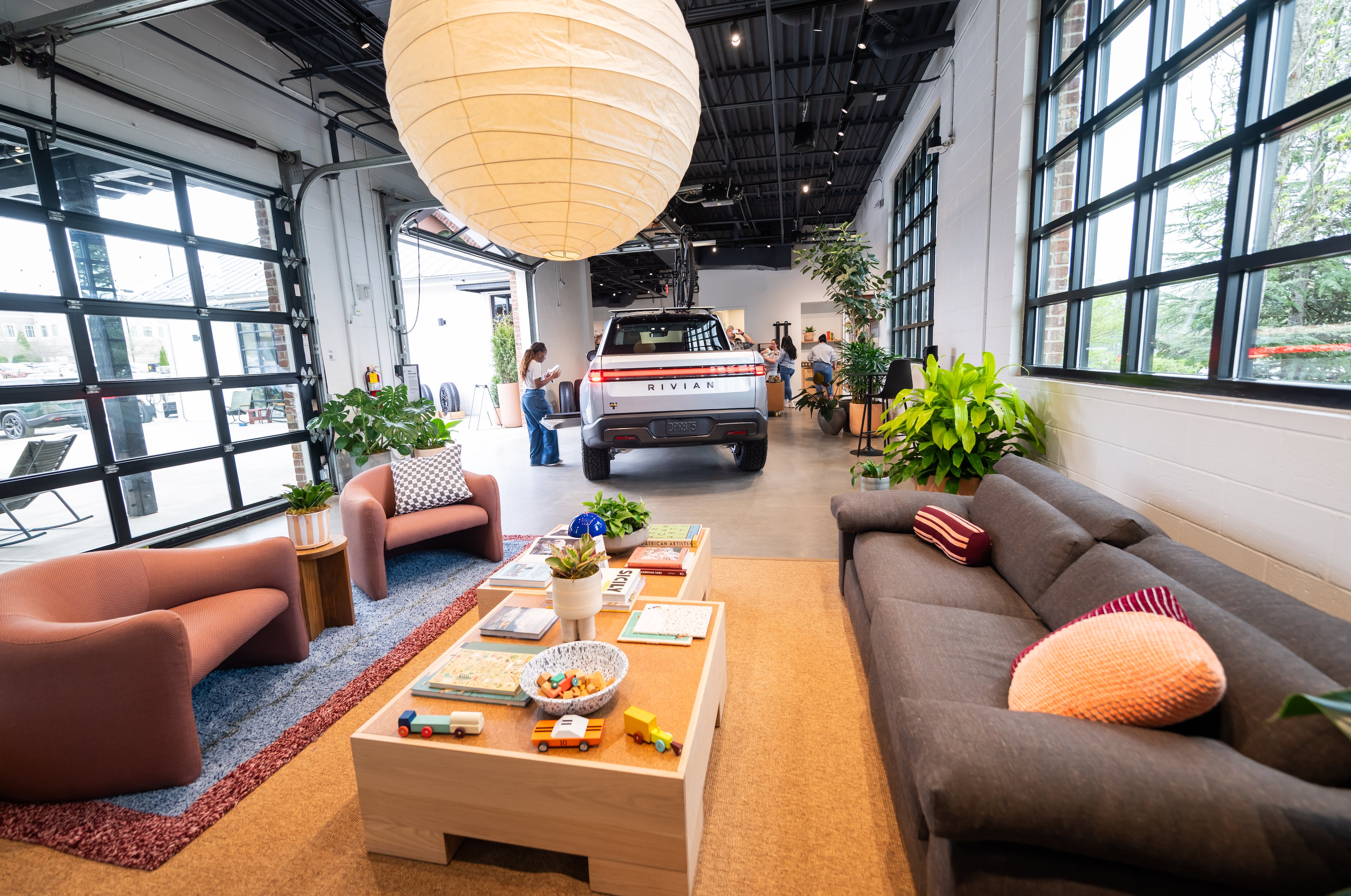 A Rivian R1T is seen adjacent to the lounge in the new Rivian “space” at Avalon in Alpharetta on Friday, April 4, 2025.
(Bita Honarvar for The Atlanta Journal-Constitution)