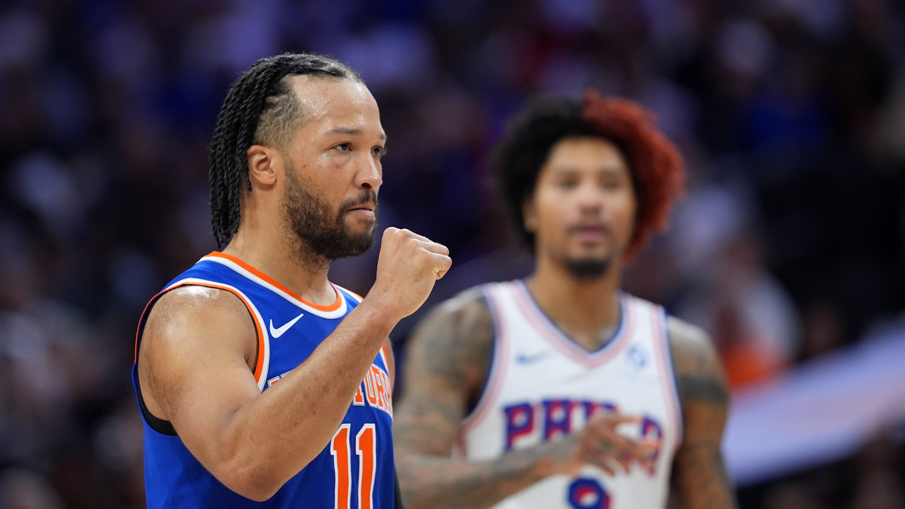New York Knicks' Jalen Brunson, left, reacts past Philadelphia 76ers' Kelly Oubre Jr. during the first half of Game 3 in a second-round NBA basketball playoff series Friday, May 8, 2026, in Philadelphia. (AP Photo/Matt Slocum)