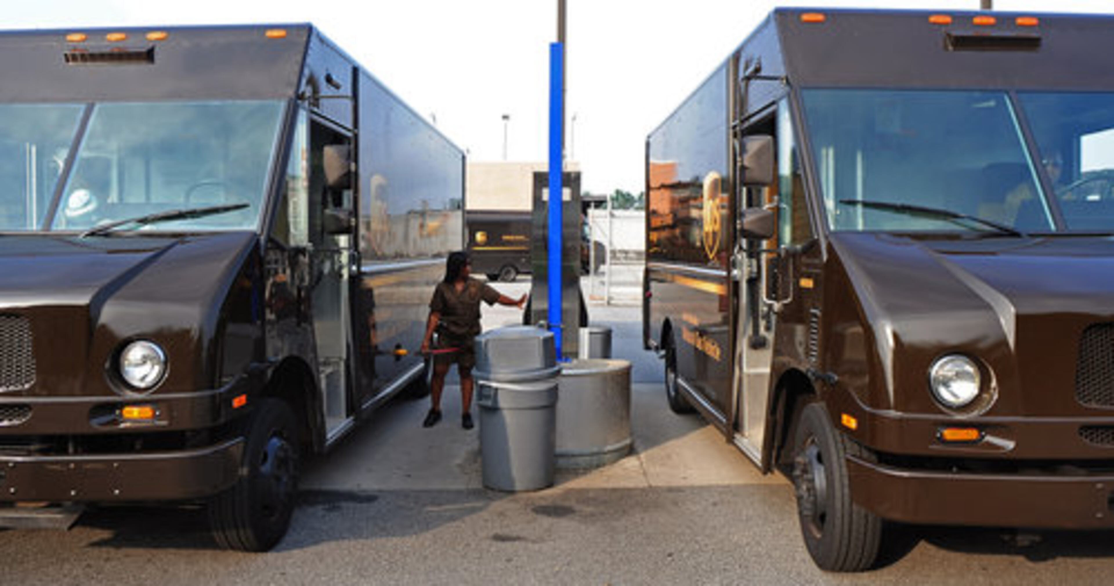 A UPS driver fills up her eco-friendlier truck with compressed natural gas at the hub. The trucks represent a small, but growing, portion of the fleet.