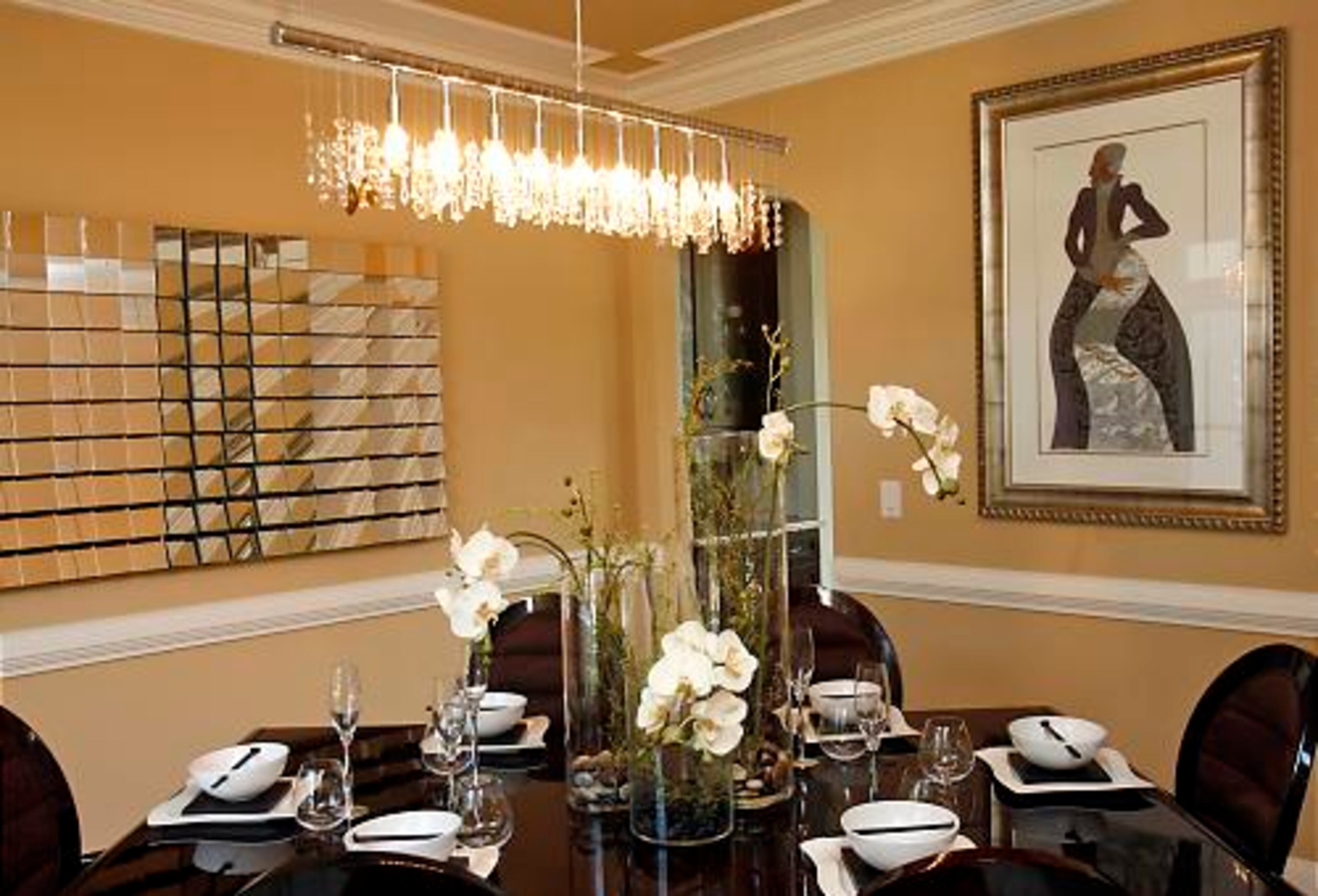 A contemporary Asian theme rules the dining room, which features a Charles Bibbs painting.