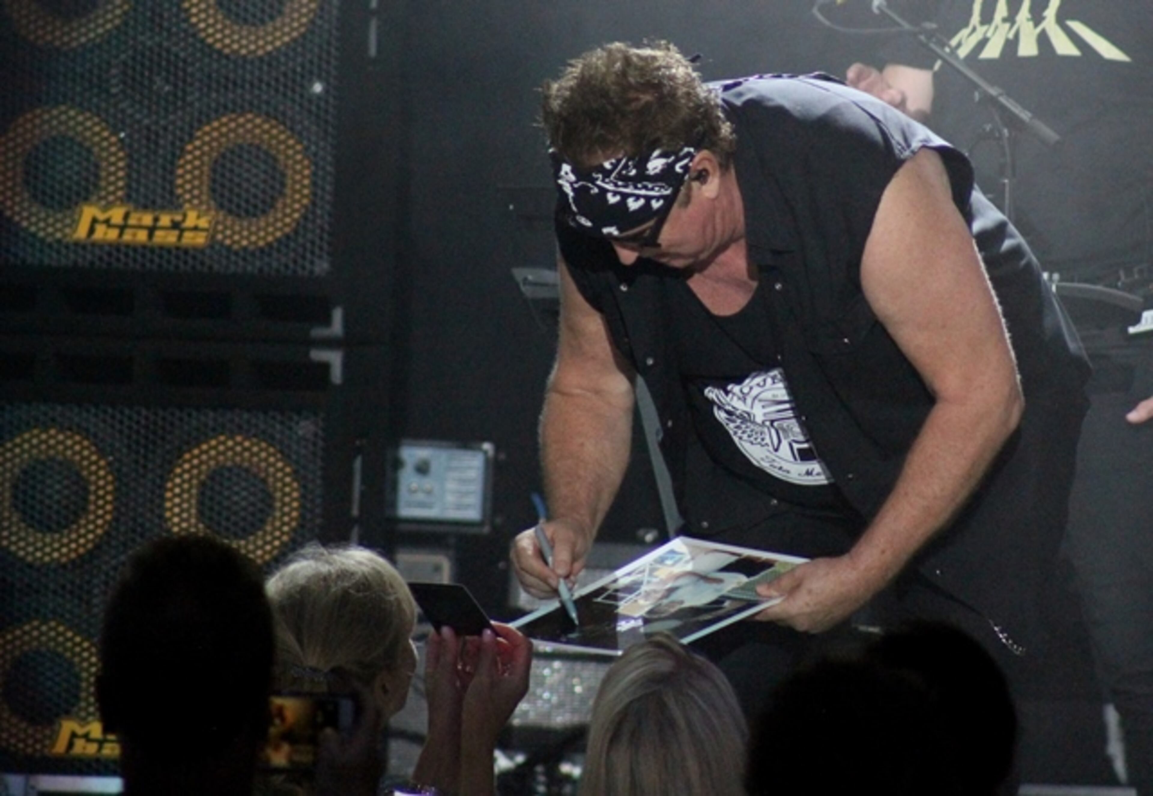 Loverboy singer Mike Reno signs autographs for fans at Chastain. Photo: Melissa Ruggieri/AJC
