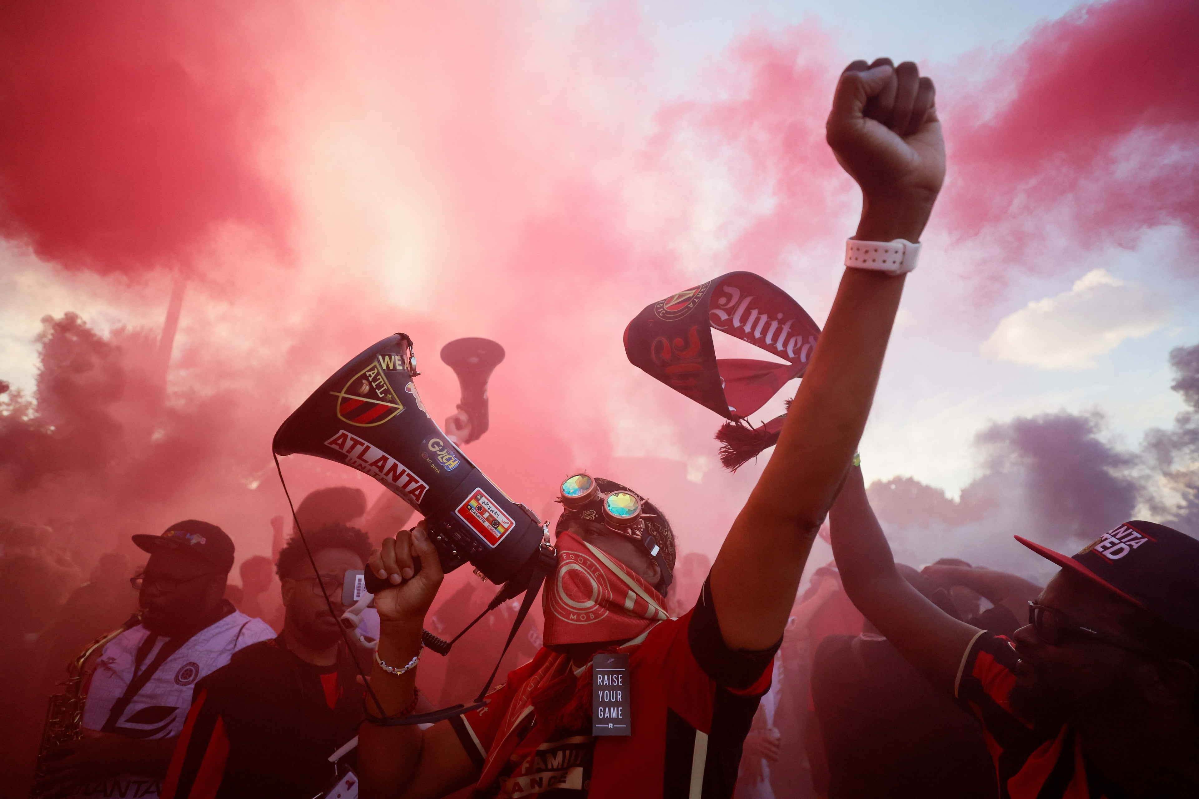 Atlanta United fans use a megaphone as they cheer before marching to the Mercedes-Benz Stadium for the MLS Cup opening-round playoff series between Atlanta United and Inter Miami on Friday, November 2, 2024, in Atlanta.
(Miguel Martinez/ AJC)