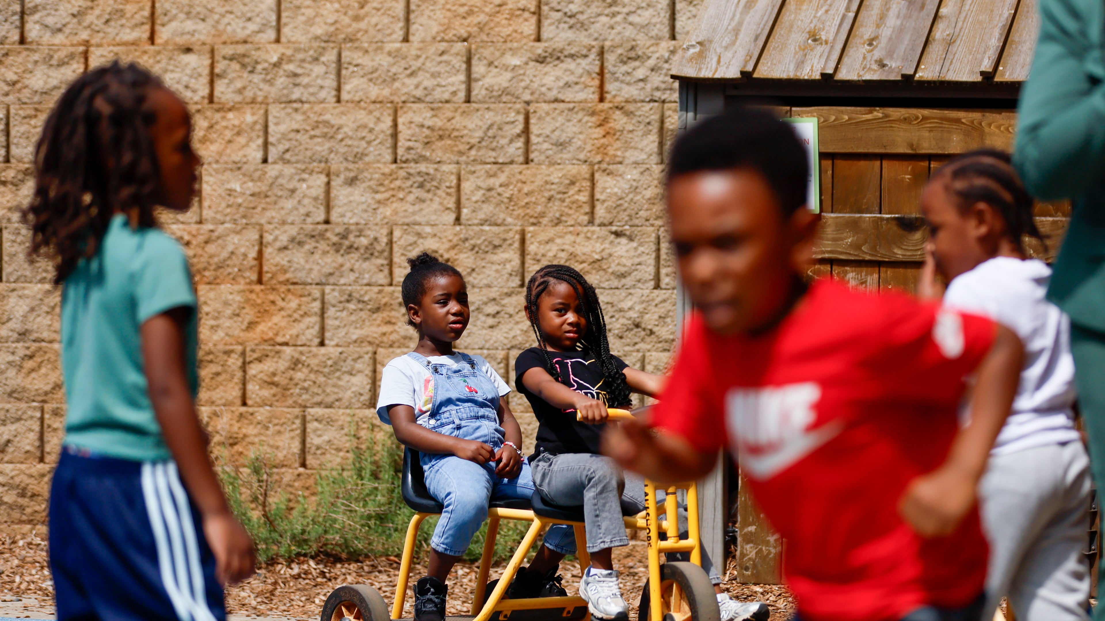 Children in the Head Start program play outside at the Arthur M. Blank Early Learning Center, where providers, parents and advocates celebrated the 60th birthday of the federal Head Start program on Monday. (Miguel Martinez/ AJC)