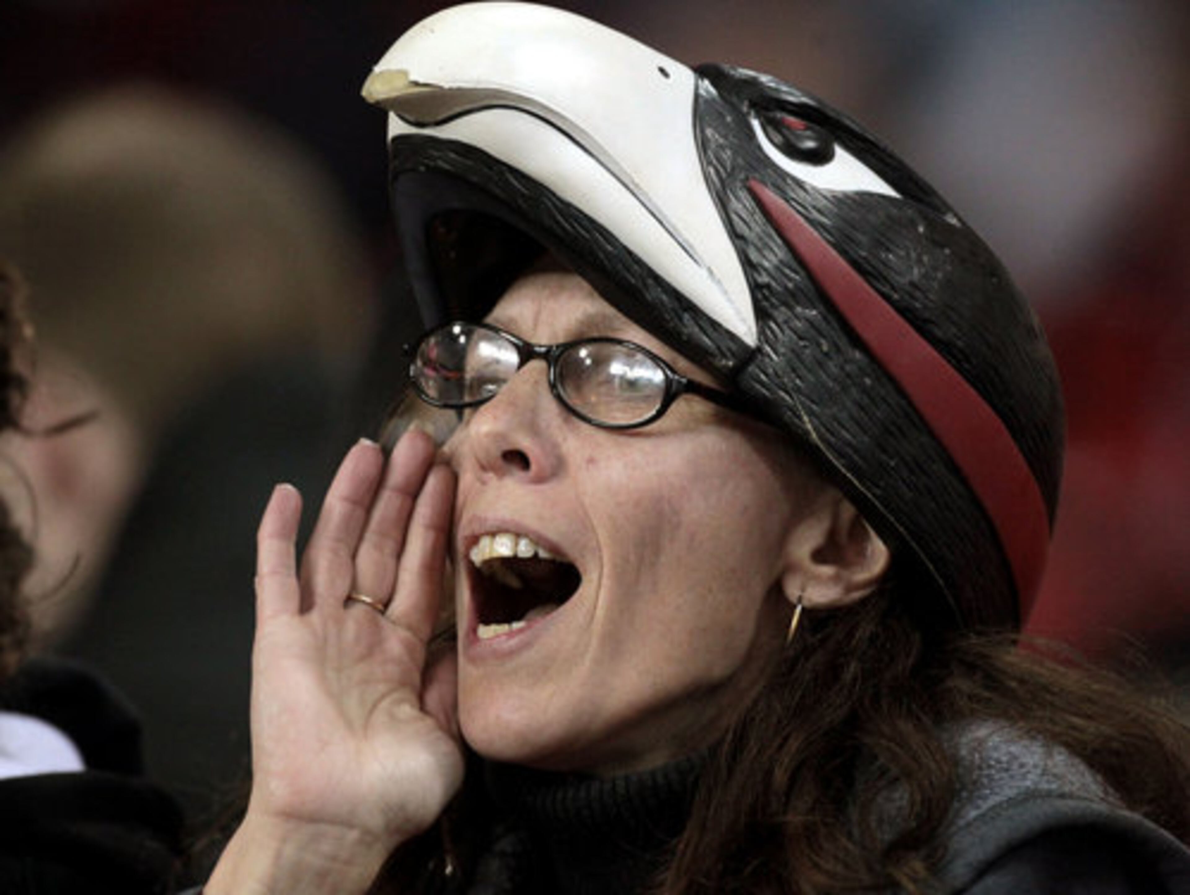 Falcon fan Jackie Kilraine, of Warner Robins, cheers on the team during warmups before its NFC divisional playoff game against the Green Bay Packers.
