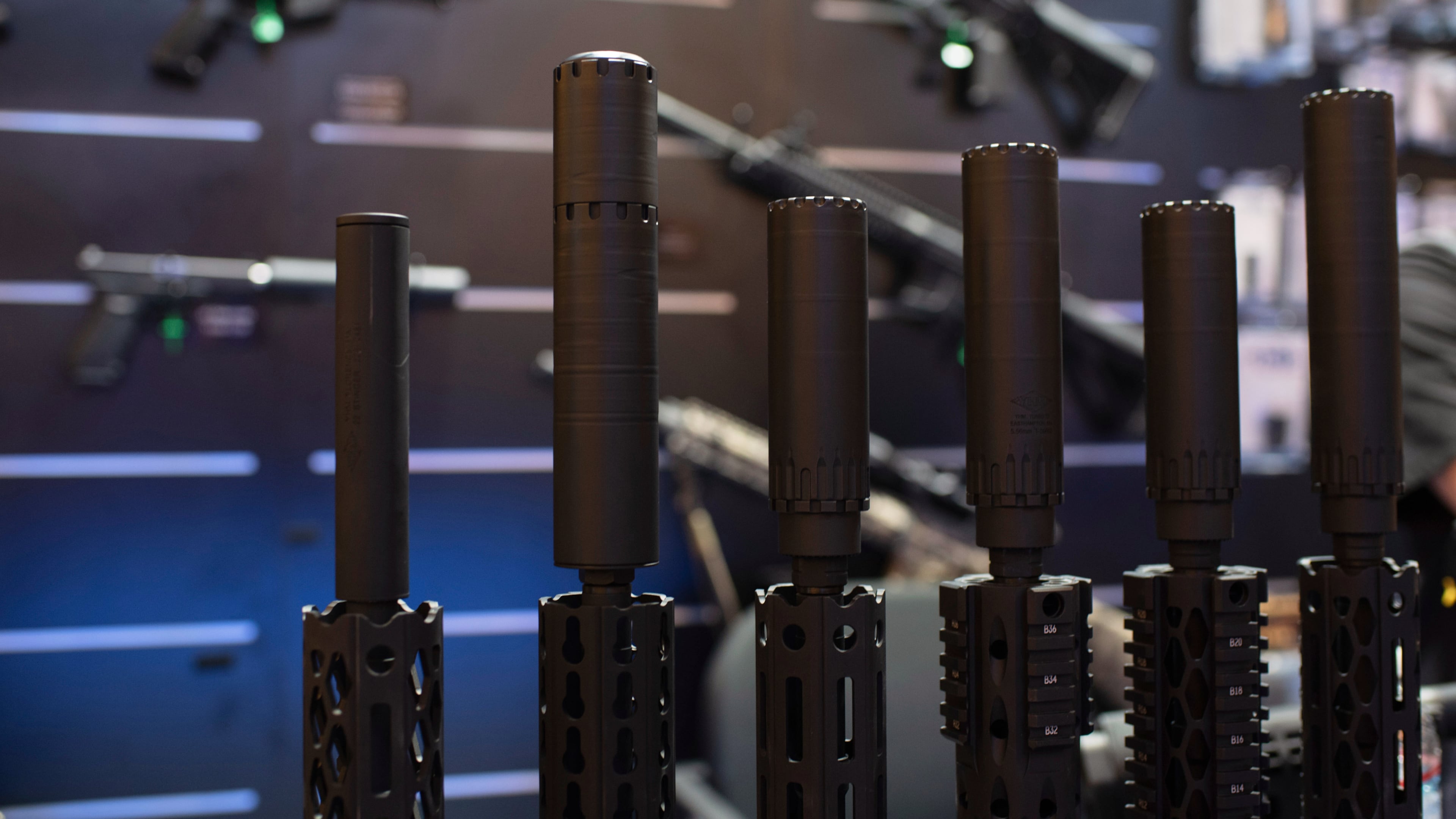 FILE - Firearms and suppressors are displayed at SHOT Show, the annual trade show for the gun industry, Jan. 21 2020, in Las Vegas. (AP Photo/Lisa Marie Pane, File)