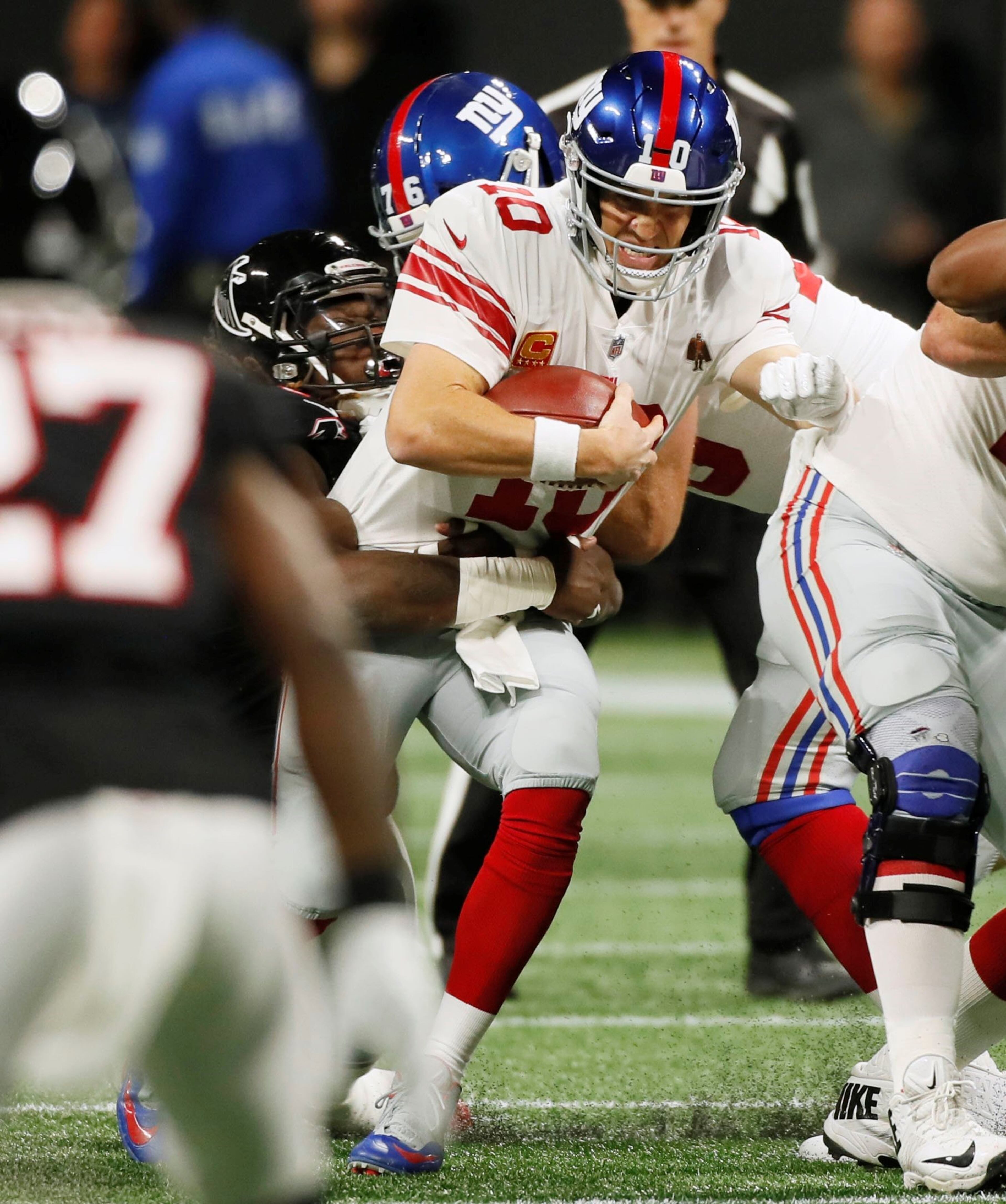 10/22/18 - Atlanta - Falcons sack New York Giants quarterback Eli Manning (10) forcing them to settle for a field goal on the drive in the first half. The Atlanta Falcons played the New York Giants in an NFL football game Monday, October 22, 2018, at Mercedes-Benz Stadium in Atlanta, GA. BOB ANDRES / BANDRES@AJC.COM