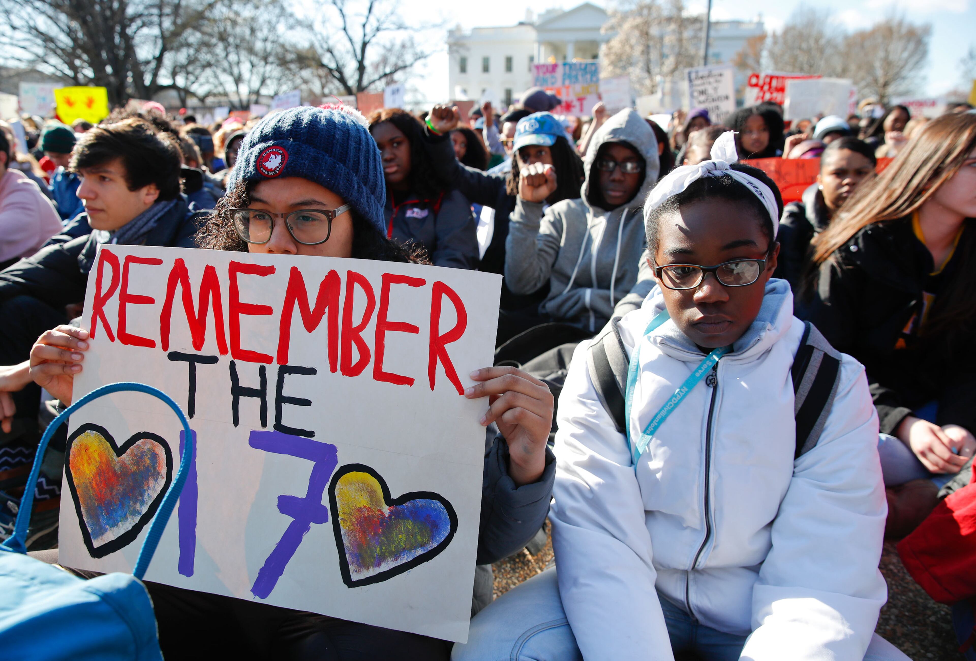 Students sit in silence as they rally in front of the White House in Washington, Wednesday, March 14, 2018. Student walked out of school to protest gun violence in the biggest demonstration yet of the student activism that has emerged in response to last month's massacre of 17 people at Florida's Marjory Stoneman Douglas High School.