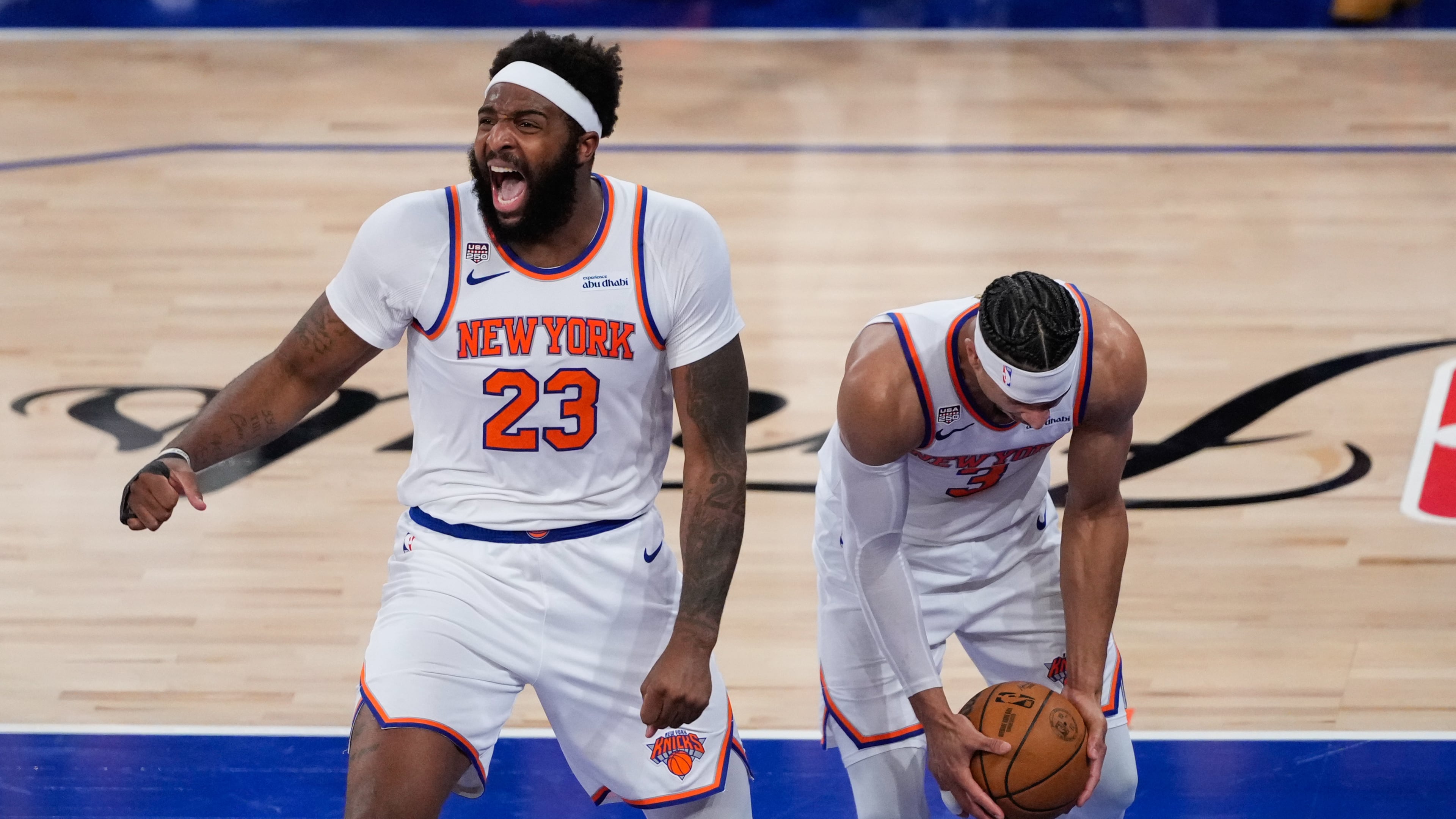 New York Knicks center Mitchell Robinson (23) and guard Josh Hart (3) celebrate after Game 4 of the NBA Finals basketball series against the San Antonio Spurs, Wednesday, June 10, 2026, in New York. (AP Photo/Ross D. Franklin)