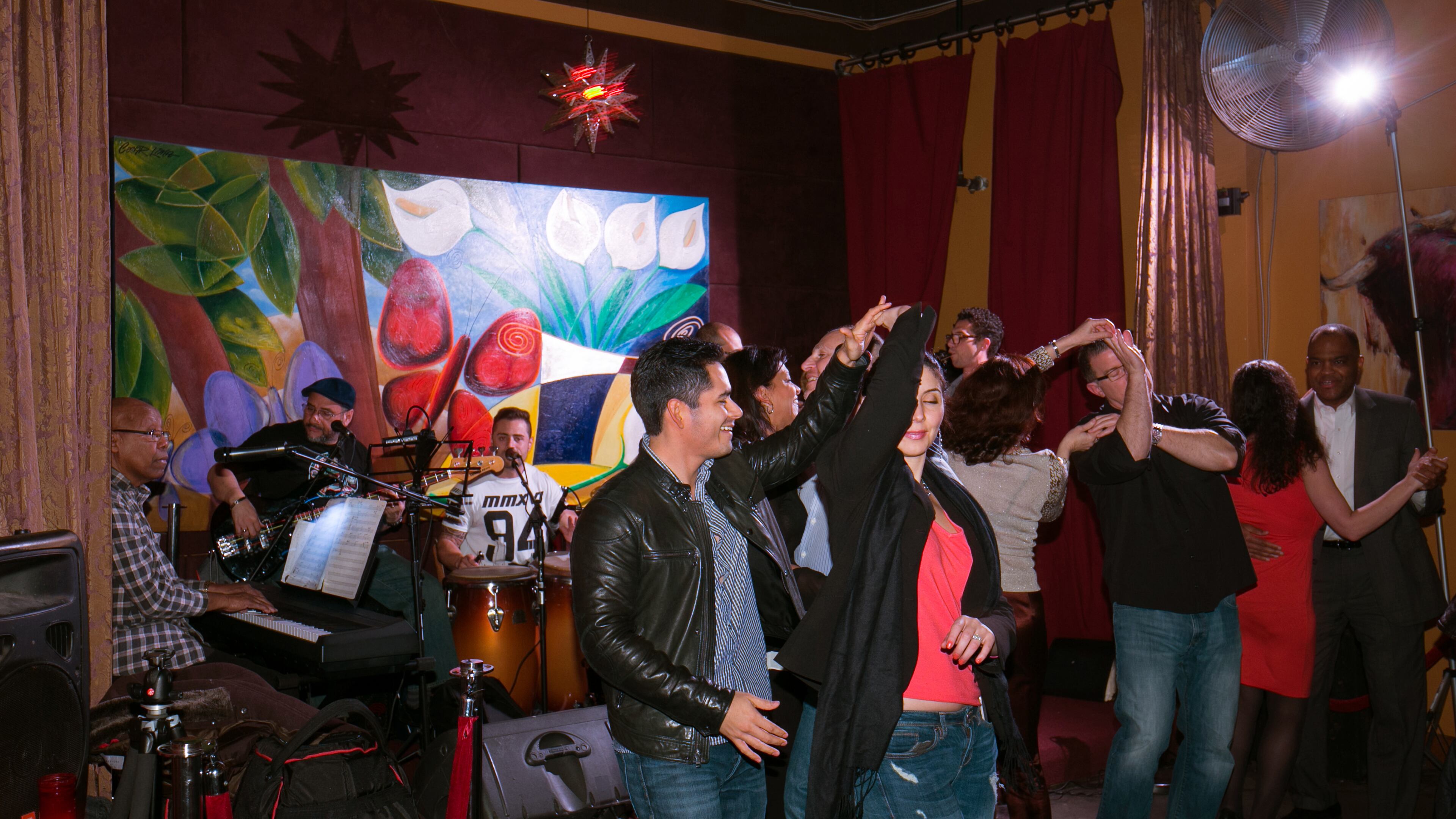 February 5, 2016 - Dunwoody, Ga: Couples dance in front of Friday night's entertainment, the Orquesta Taboga, at Eclipse di Luna Friday, February 5, 2016, in Dunwoody, Ga. Eclipse di Luna regularly has a band performing on the weekend, starting at 8:30pm. This is story about Cinco de Mayo celebrations in restaurants across the North Fulton areas. This is for the April issue of Living Northside. PHOTO / JASON GETZ