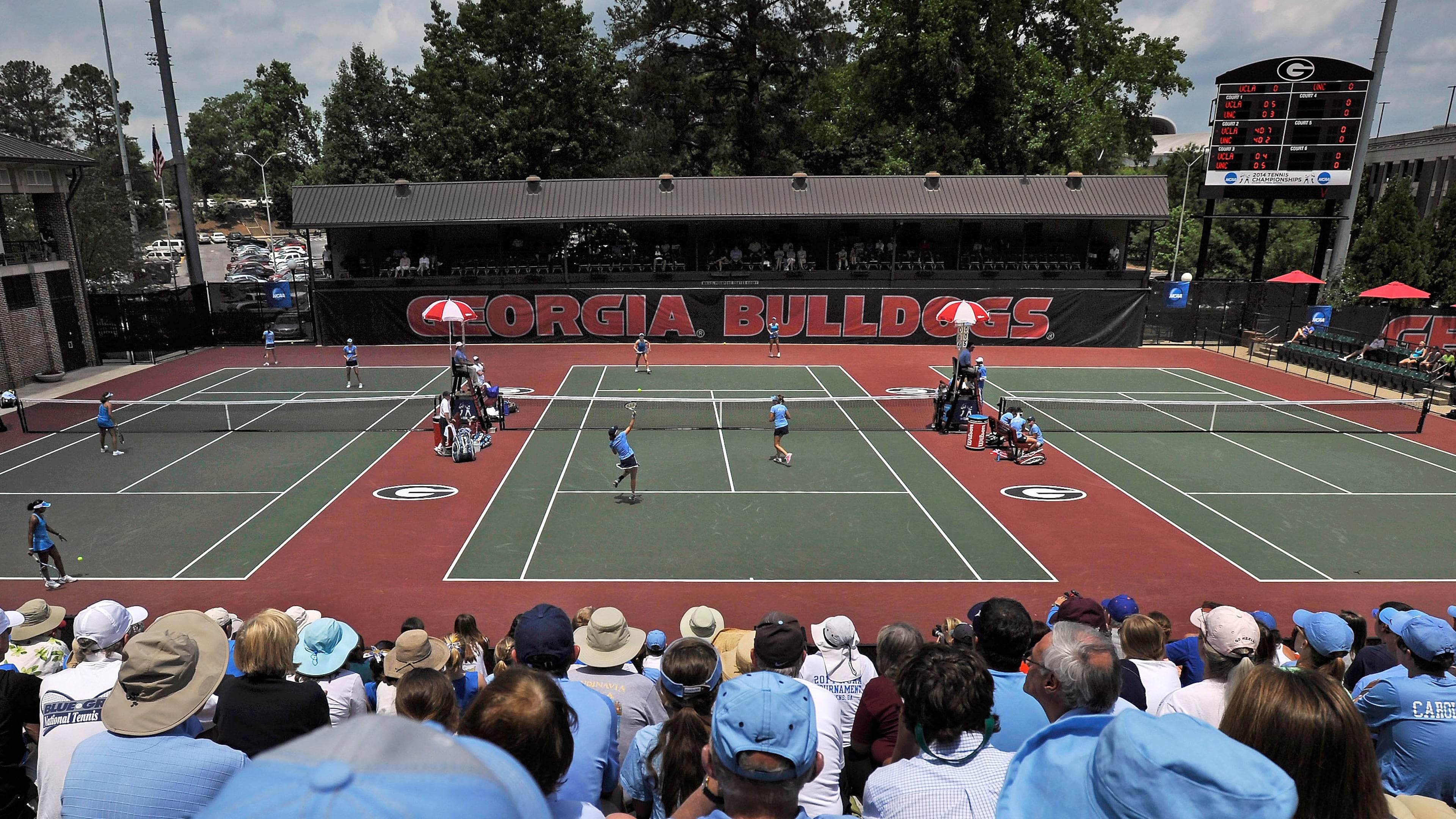 FILE - Spectators crowd center court at the Dan Magill Tennis Complex during the UCLA and North Carolina women's doubles match in the NCAA Division I tennis championships, May 20, 2014, in Athens, Ga. (AP Photo/David Tulis, File)