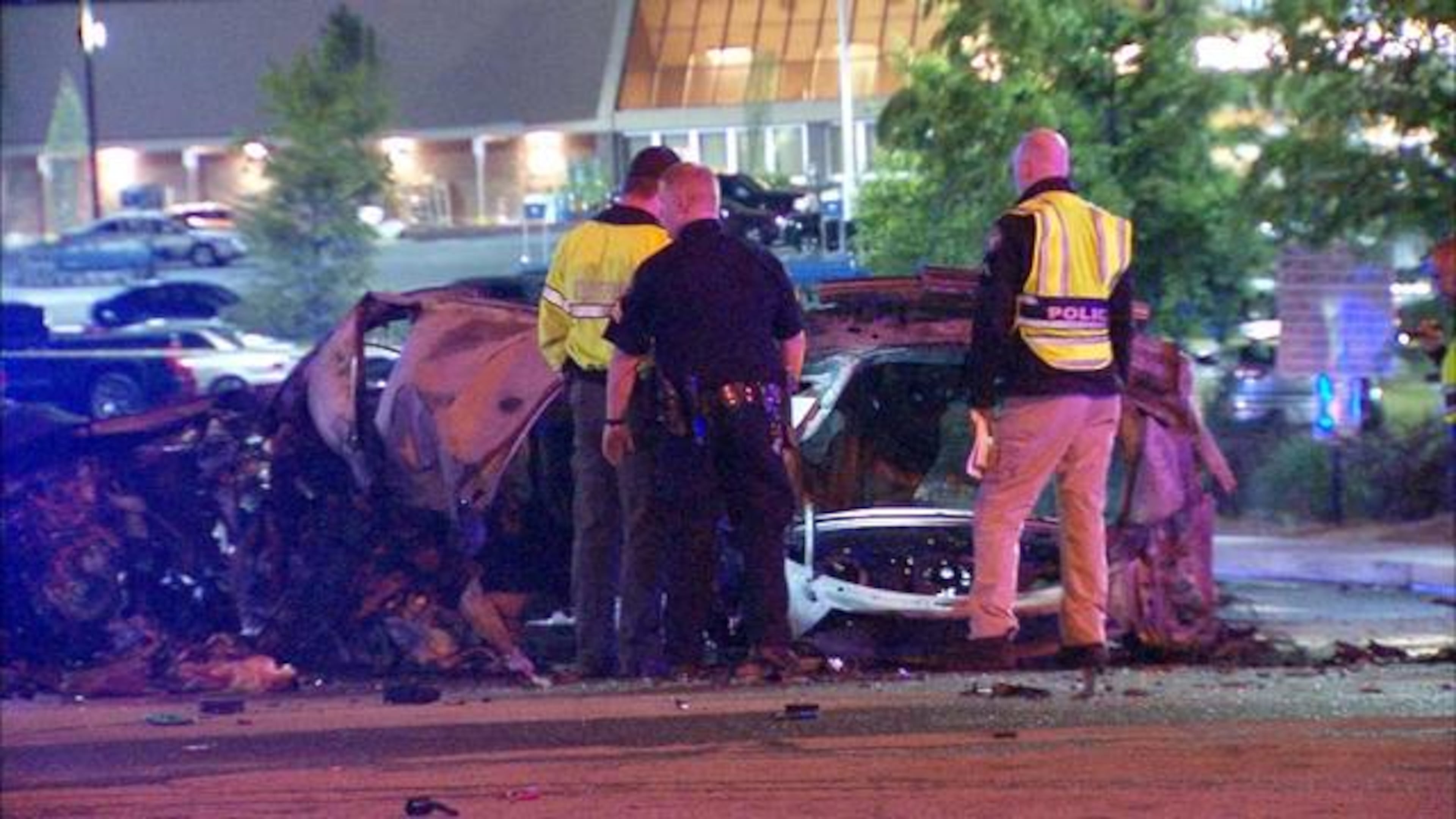 A car split in two outside a northeast Atlanta Kroger on Thurs., April 14, 2016. (Credit: Channel 2 Action News)