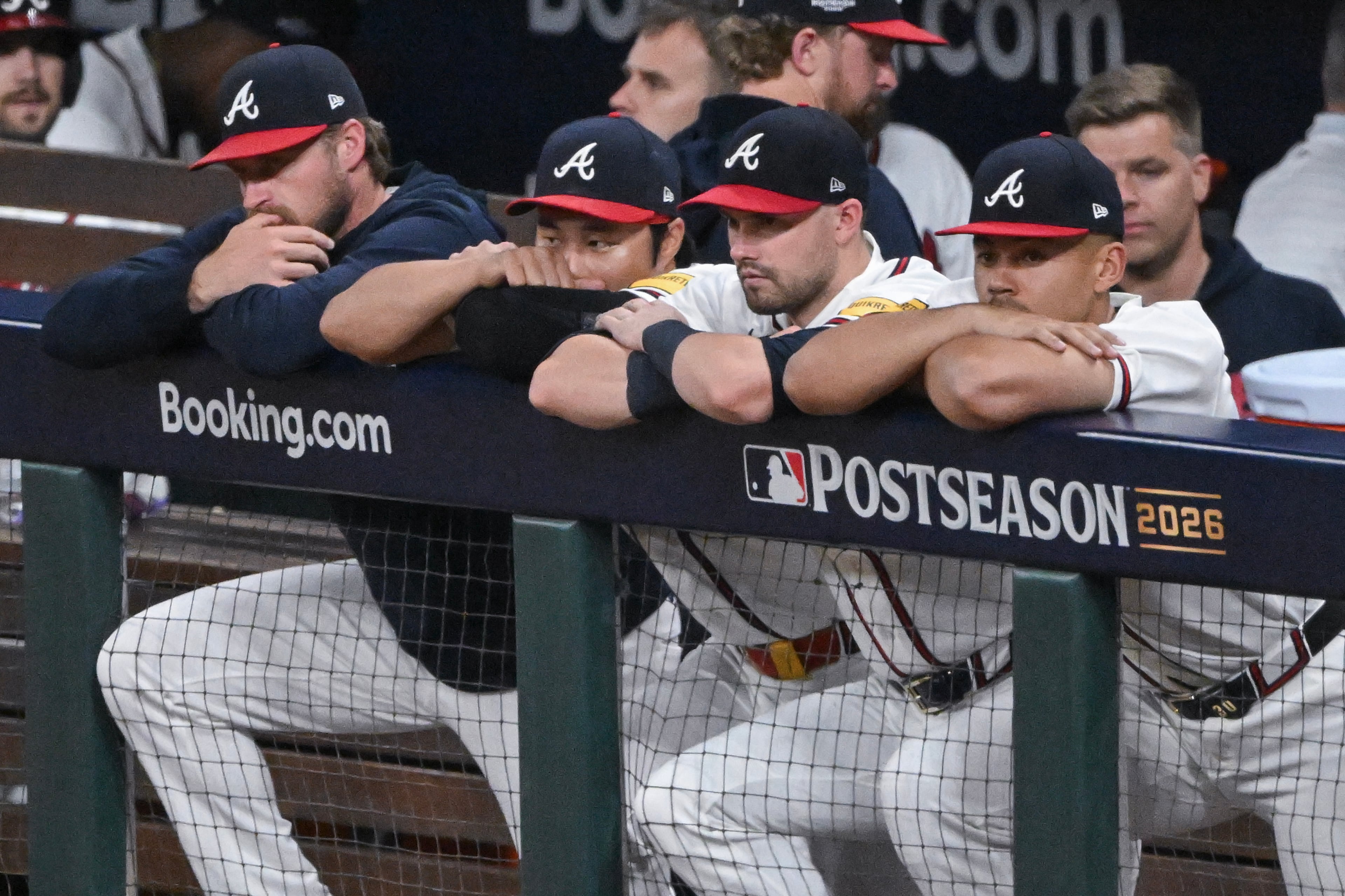 The Atlanta Braves react in the dugout after losing to the Los Angeles Dodgers in Game 4 of the MLB National League Division Series between the Atlanta Braves and the Los Angeles Dodgers, Wednesday, Oct. 7, 2026, in Atlanta. The Dodgers defeated the Braves 3 games to 1. (Hyosub Shin/AJC)