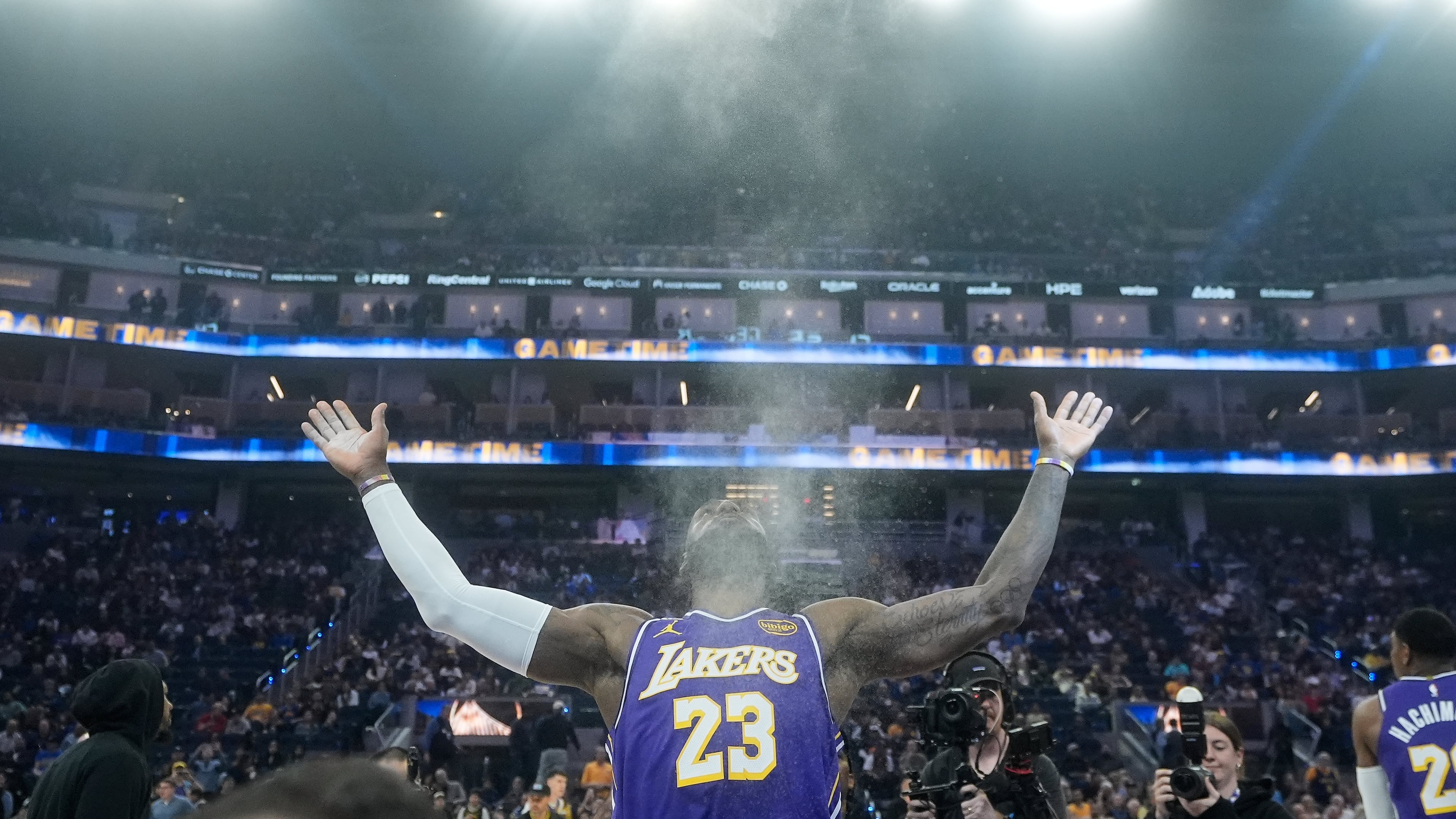FILE - Los Angeles Lakers forward LeBron James throws chalk in the air before an NBA basketball game against the Golden State Warriors in San Francisco, April 9, 2026. (AP Photo/Jeff Chiu, File)