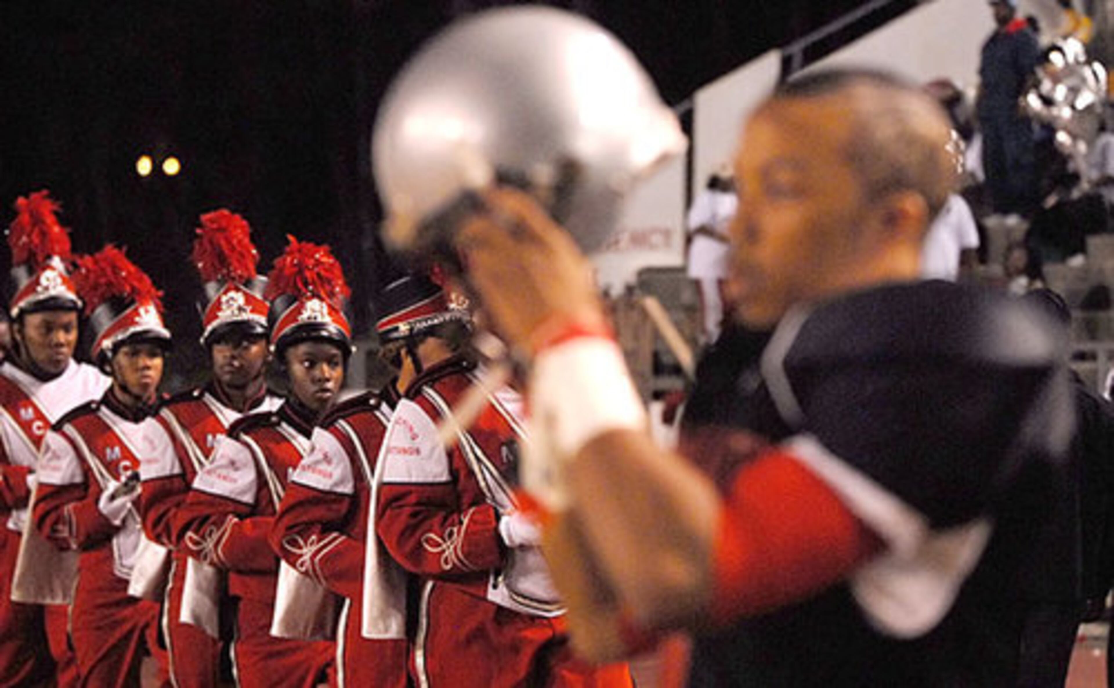 McNair's Arnold Walker gears up with The McNair Mighty Marching Mustang Band behind him.