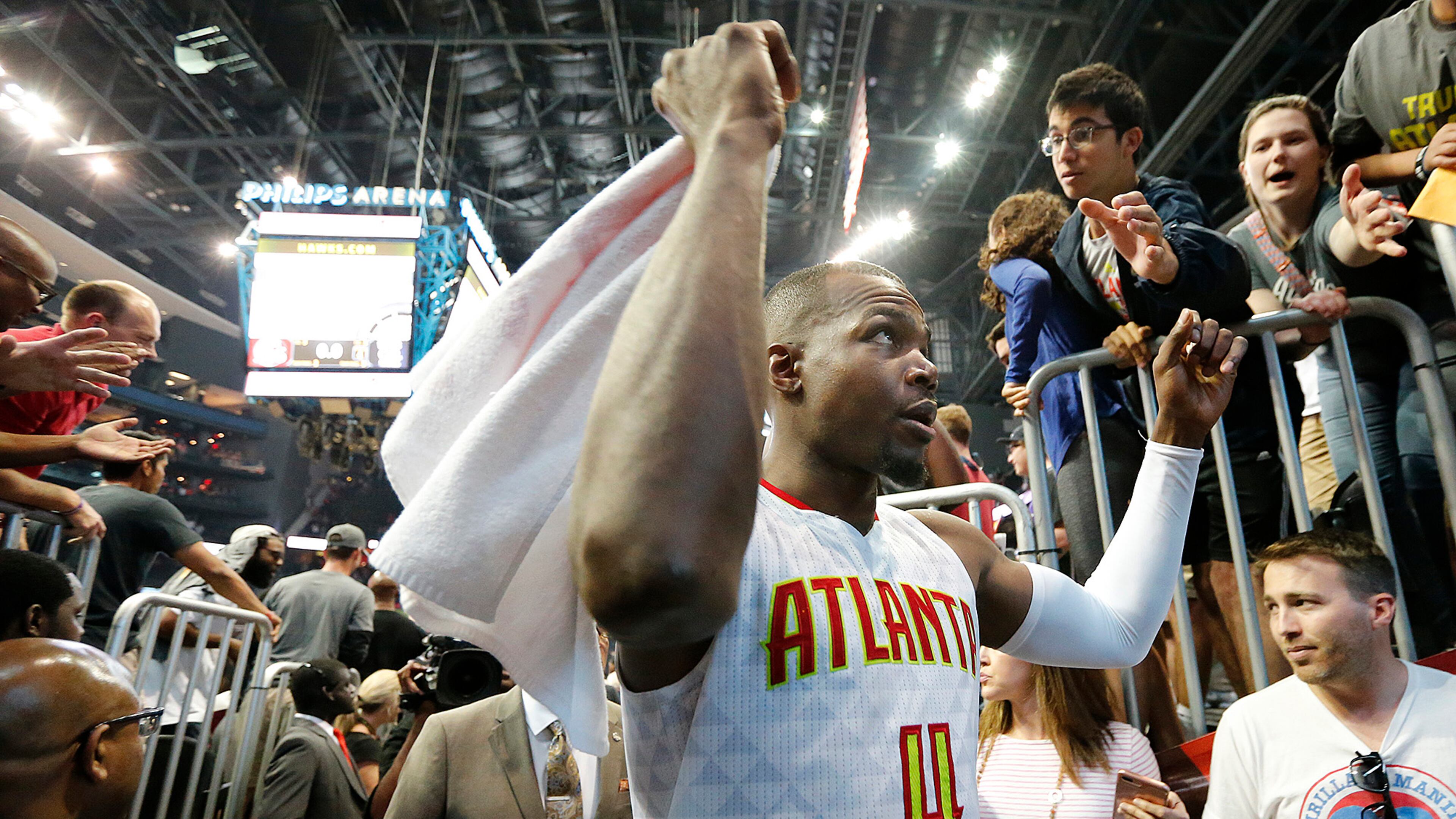 Paul Millsap celebrates a 116-98 Hawks victory over the Wizards with fans after Game 3 of a first-round NBA basketball playoff series on Saturday, April 22, 2017, in Atlanta. Curtis Compton/ccompton@ajc.com