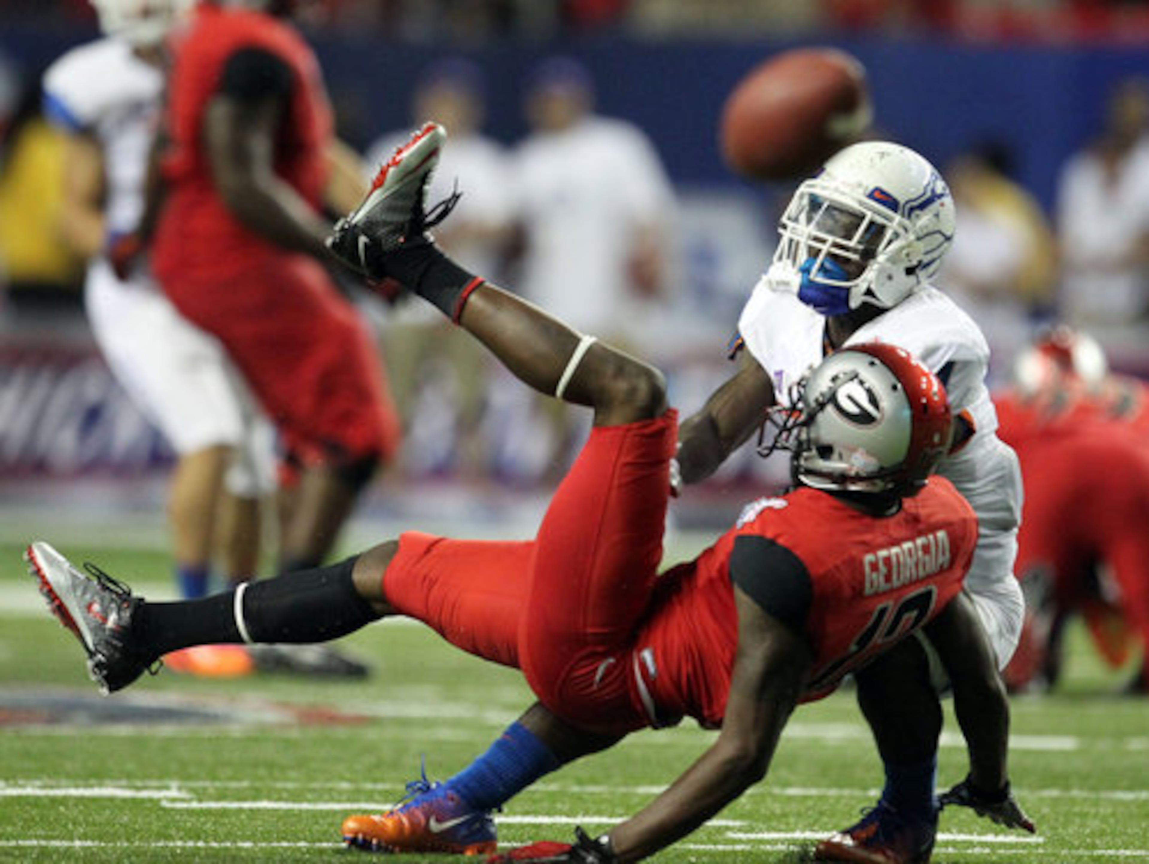 Georgia receiver Tavarres King (12) gets tangled up with Boise State cornerback Jerrell Gavins (4) and can't to make a fourth down catch in the fourth quarter