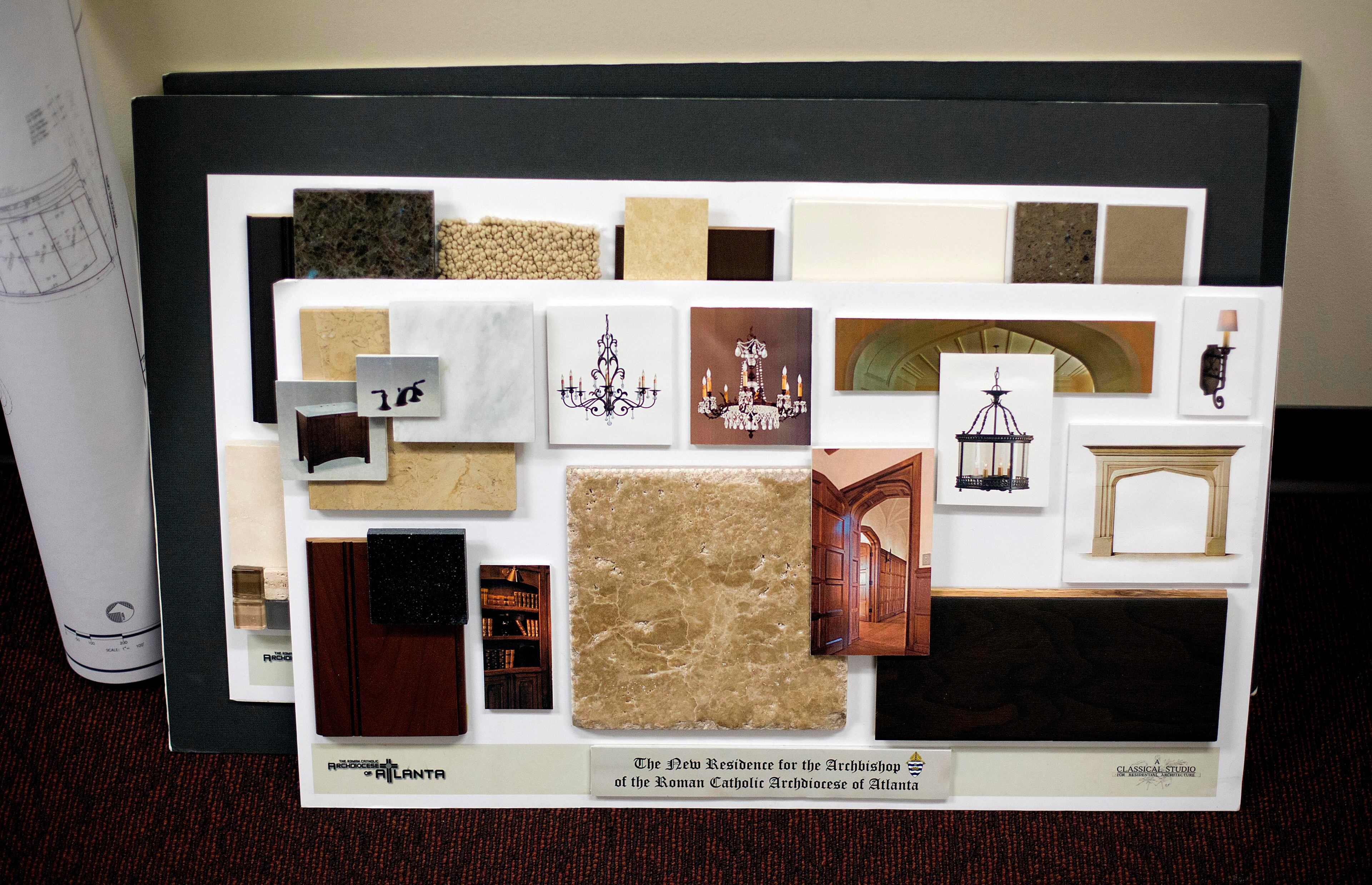Interior decorating samples for the proposed new residence of Atlanta Archbishop Wilton Gregory is seen inside a conference room during an interview with Gregory, Wednesday, April 2, 2014, in Smyrna, Ga. The Roman Catholic Archbishop of Atlanta says he suspects the church will ultimately sell a $2.2 million mansion built for his use. Gregory said in an interview with The Associated Press on Wednesday that he accepts blame for not consulting enough with members of the church before building the expansive residence in one of Atlanta's toniest neighborhoods. (AP Photo/David Goldman)