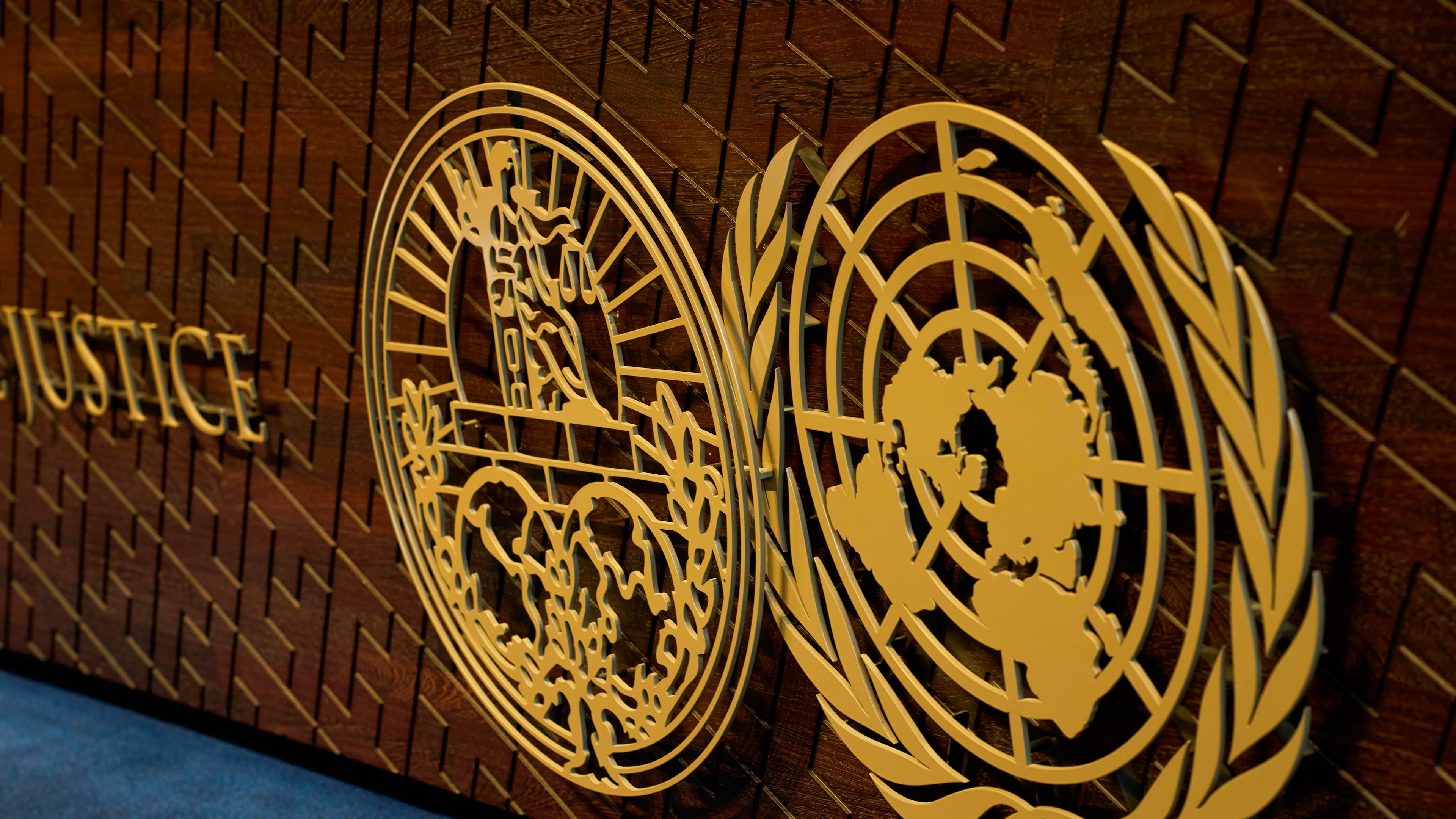 FILE - The logo of the International Court of Justice displayed on the judges' bench, in The Hague, Netherlands, May 4, 2026. (AP Photo/Peter Dejong, File)