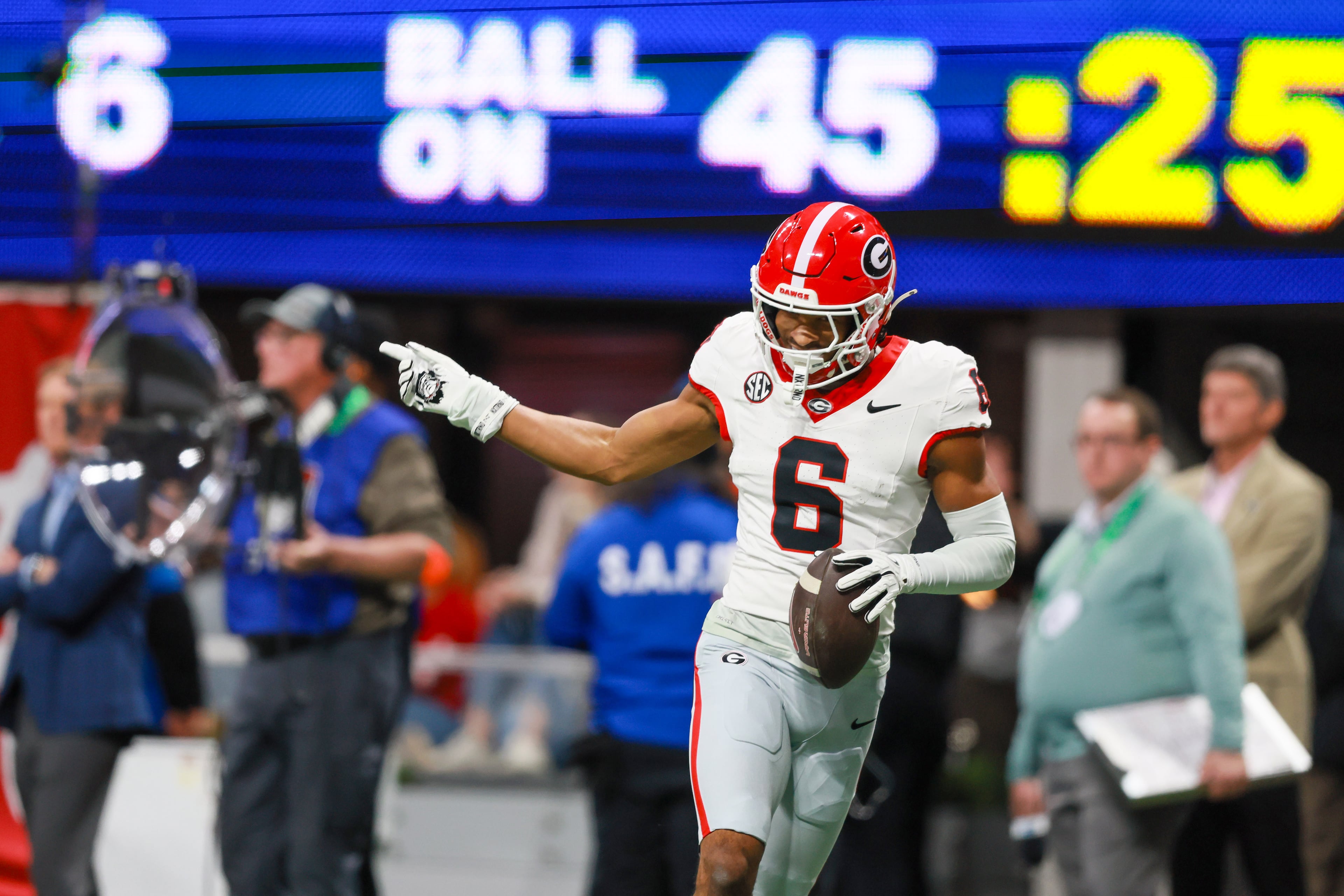 Georgia defensive back Daylen Everette (6) runs after intercepting a pass from Alabama quarterback Ty Simpson during the first half of the SEC Championship game at Mercedes-Benz Stadium, Saturday, Dec. 6, 2025, in Atlanta. (Jason Getz / AJC)