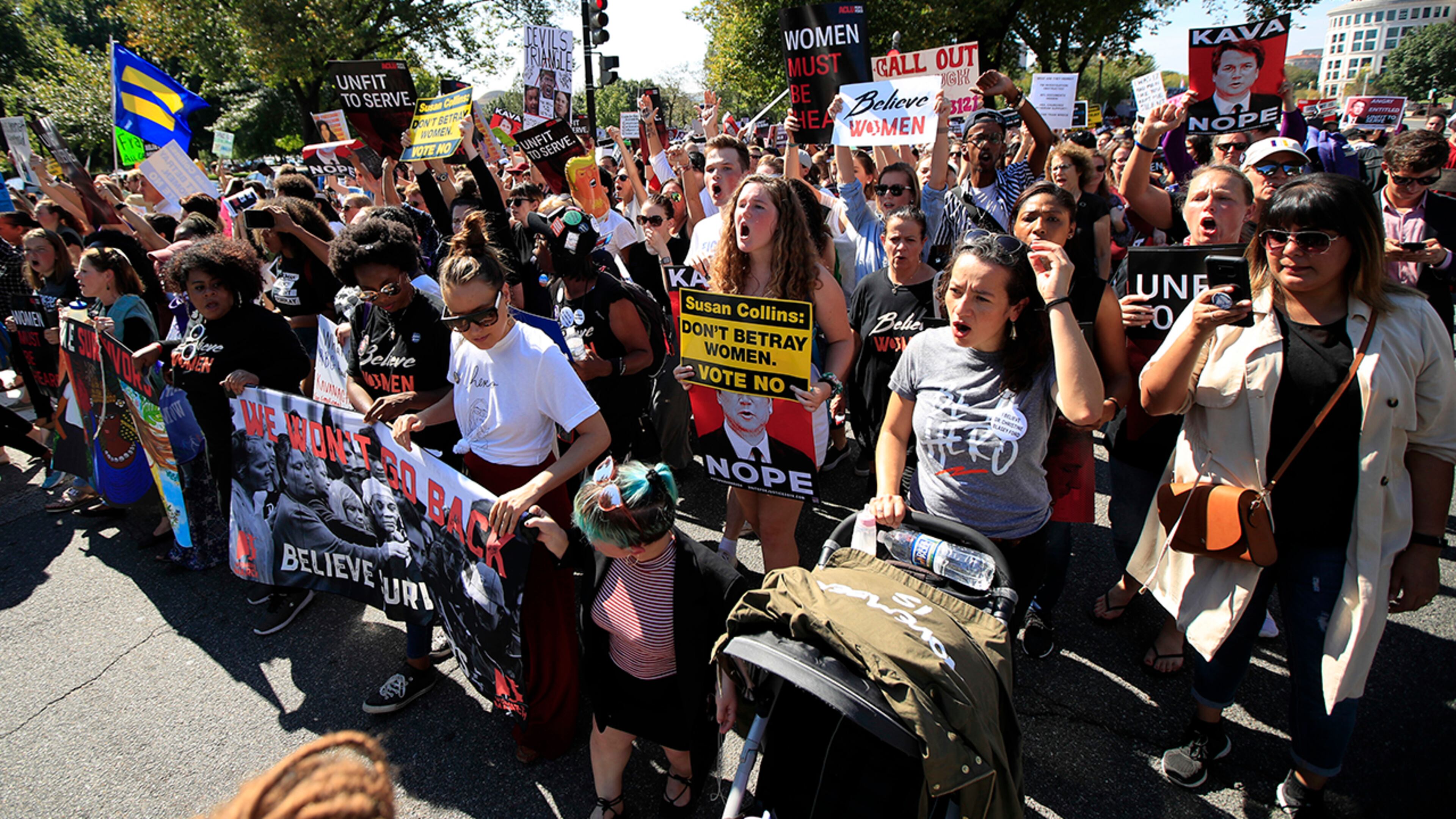 Protesters against Supreme Court nominee Brett Kavanaugh march towards the Supreme Court in Washington, Thursday, Oct. 4, 2018. (AP Photo/Manuel Balce Ceneta)