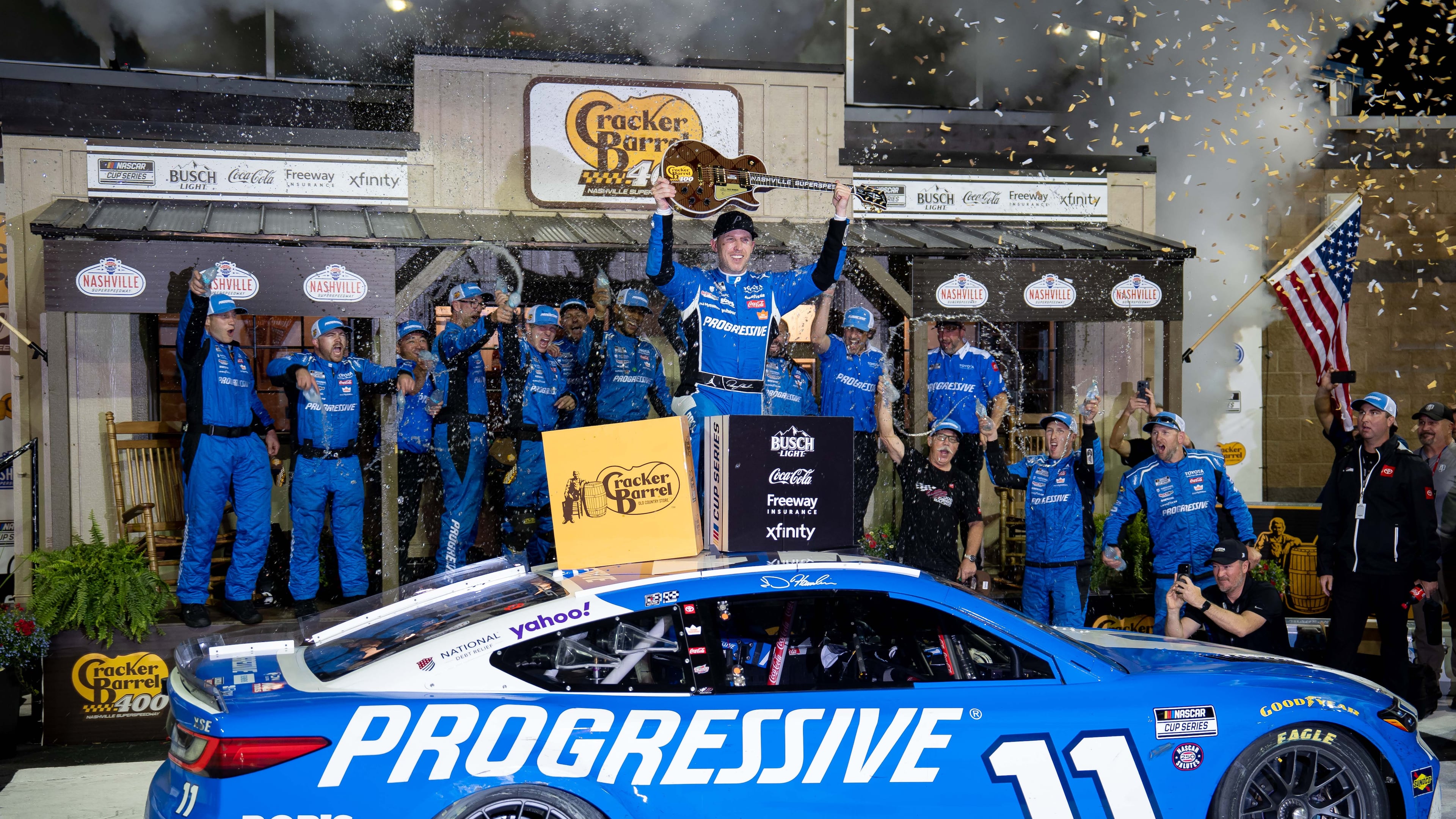 Denny Hamlin celebrates after winning a NASCAR Cup Series auto race, Sunday, May 31, 2026, in Lebanon, Tenn. (AP Photo/Camden Hall)