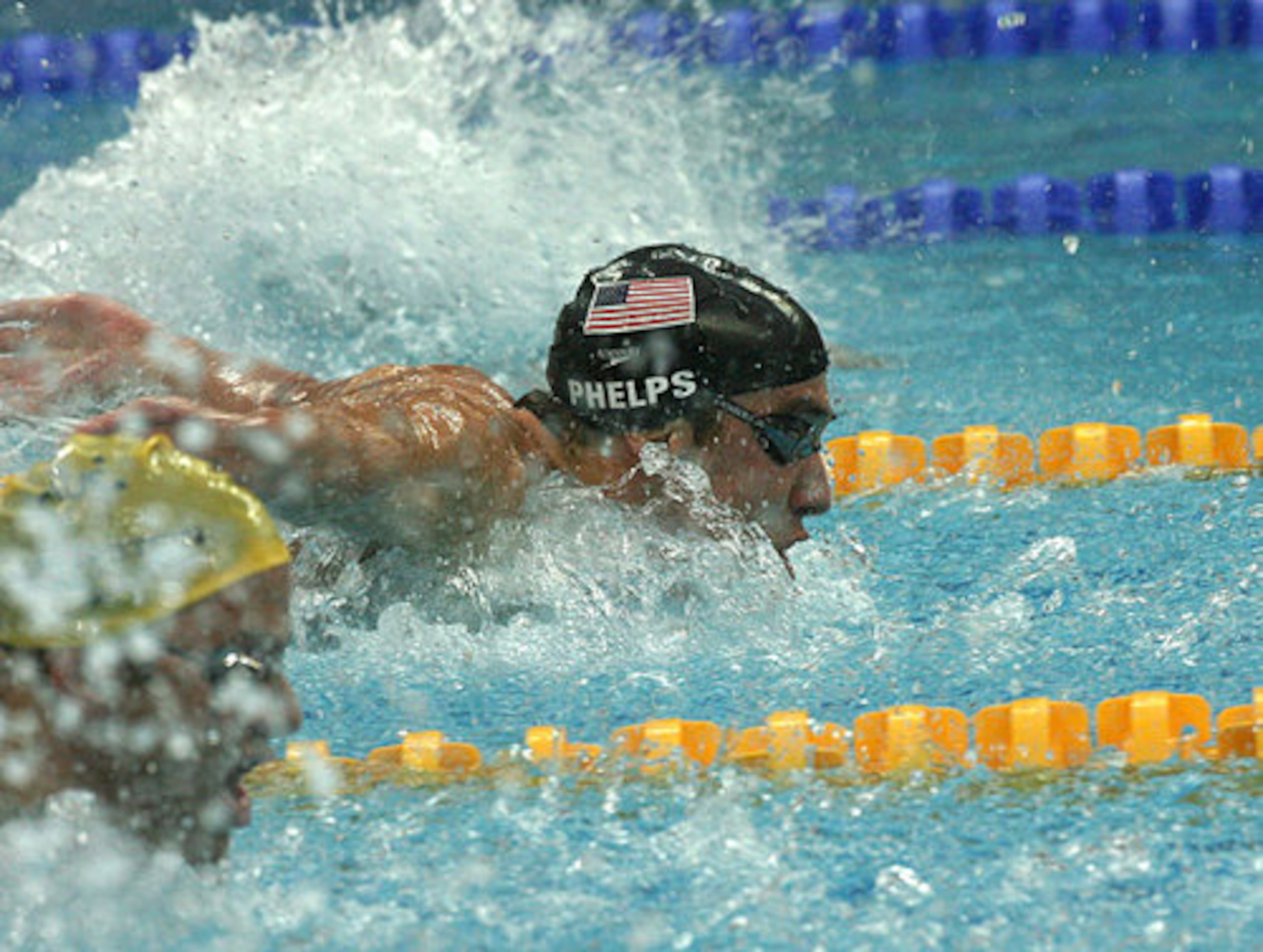 Phelps does his part in winning the gold by swimming the breastsroke leg of the 4x100-meter relay.