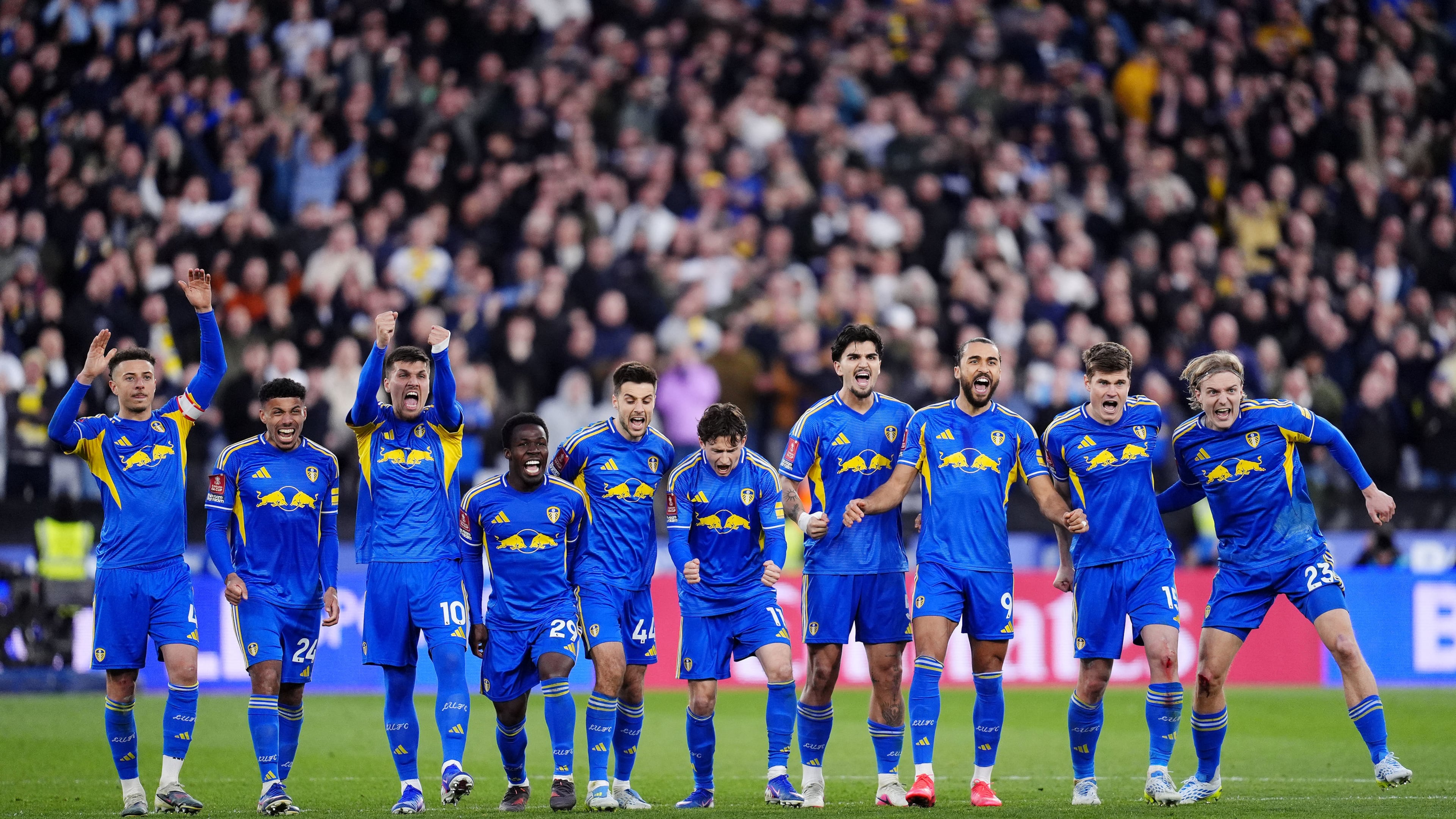 Leeds United's Dominic Calvert-Lewin, third right, and teammates celebrate in the penalty shoot-out during the English FA Cup quarterfinal soccer match between West Ham United and Leeds United, in London, Sunday April 5, 2026. (John Walton/PA via AP)